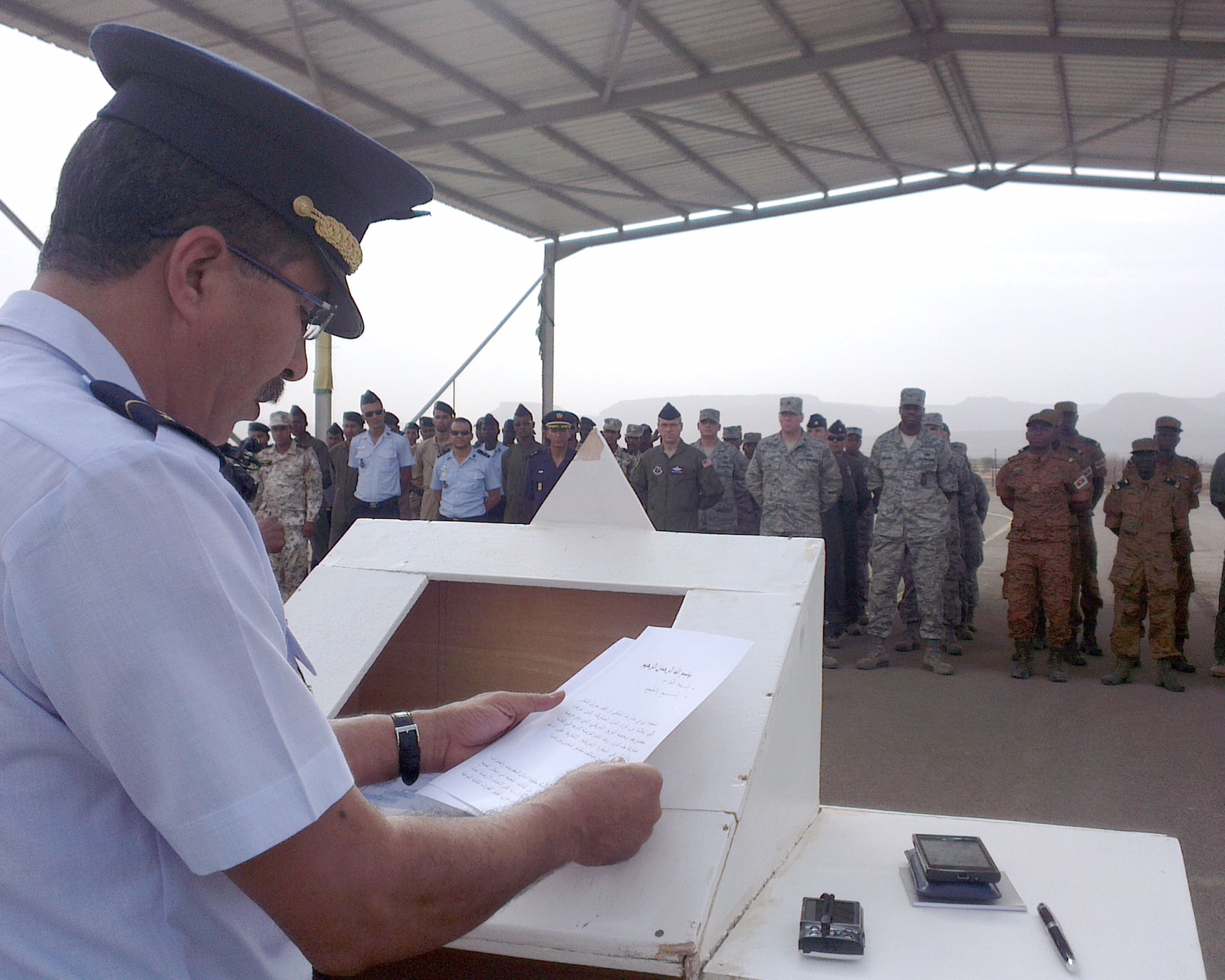 Col. Mohammad Lehreitani, Mauritania Air Force chief in command, addresses the African Partnership Flight Mauritania students during the closing ceremony Sept. 4, 2014, at Atar Airbase in Mauritania. About 55 students completed the week-long course in Atar which taught and tested the airmen on ground and flight safety; Intelligence, Surveillance and Reconnaissance; and air command operations. (U.S. Air Force photo/Master Sgt. Brian Boisvert/Released)