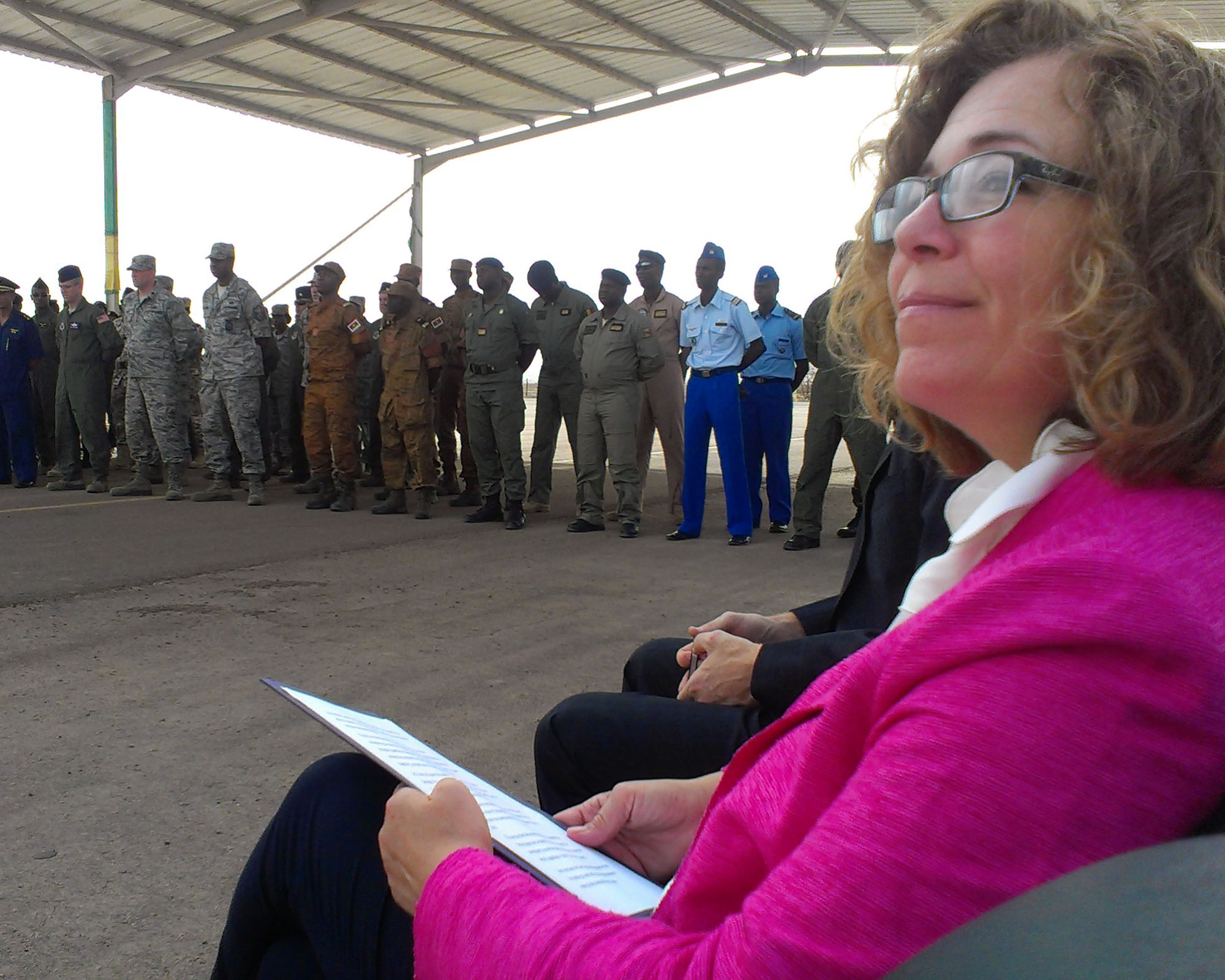 Martha Patterson, Charge d’Affaires, U.S. Embassy in Mauritania, listens to speeches Sept. 4, 2014, at Atar Airbase in Mauritania, prior to making her speech during the graduation ceremony for students completing African Partnership Flight Mauritania. During her speech, Patterson congratulated the students for completing the course and sharing their experiences with each of the six participating African nations. (U.S. Air Force photo/Master Sgt. Brian Boisvert/Released)