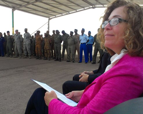 Martha Patterson, Charge d’Affaires, U.S. Embassy in Mauritania, listens to speeches Sept. 4, 2014, at Atar Airbase in Mauritania, prior to making her speech during the graduation ceremony for students completing African Partnership Flight Mauritania. During her speech, Patterson congratulated the students for completing the course and sharing their experiences with each of the six participating African nations. (U.S. Air Force photo/Master Sgt. Brian Boisvert/Released)