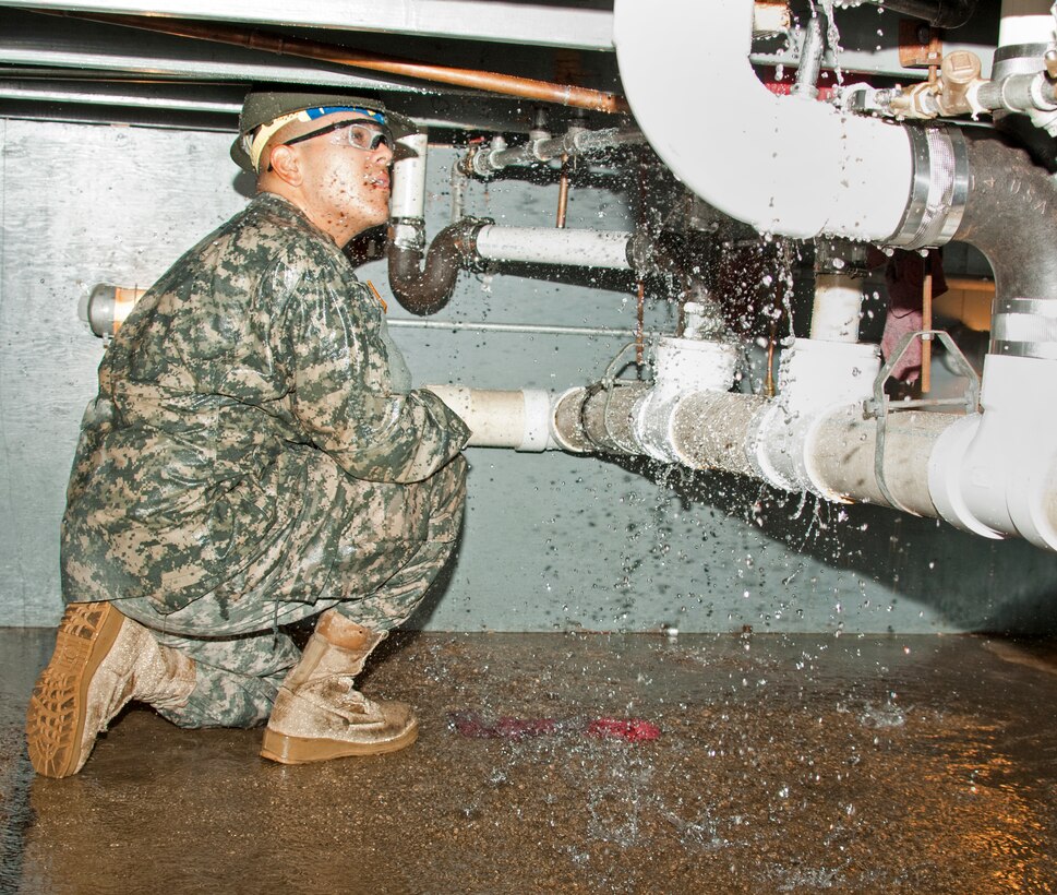 Pvt. Jorje Perez, student at 366th Training Squadron, was identifying leaks during the water and fuel systems maintenance course Sept. 2, 2014. The block instructors placed various troubles in the student plumbing systems that they have been constructing since Block 1, and they construct entire plumbing systems for a bathroom from “rough-in” to finish plumbing.  The final objective before taking the block test is to troubleshoot the plumbing systems and make repairs so that there are no leaks and all fixtures operate properly. (U.S. Air Force Photo Danny Webb/Released)