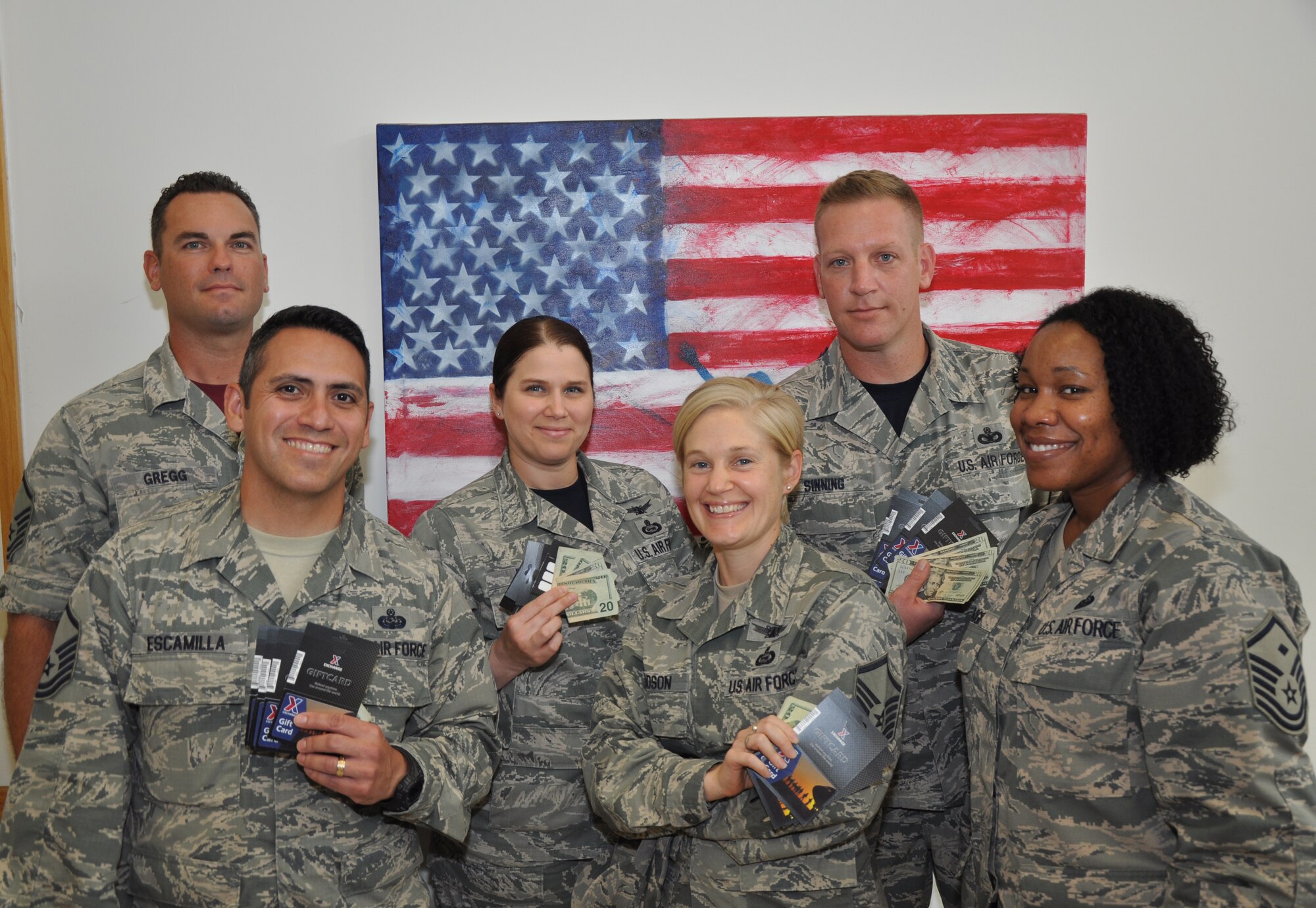 GOODFELLOW AIR FORCE BASE, Texas – Before an Operation Warmheart event, first sergeants and assistant first sergeants pose for a picture at the Goodfellow Exchange Aug 29. The first sergeants host several Operation Warmheart events throughout the year, but the program is more visible towards the end of the year when they collect food to present to enlisted members for holiday meals. (U.S. Air Force photo/ Senior Airman Joshua Edwards)