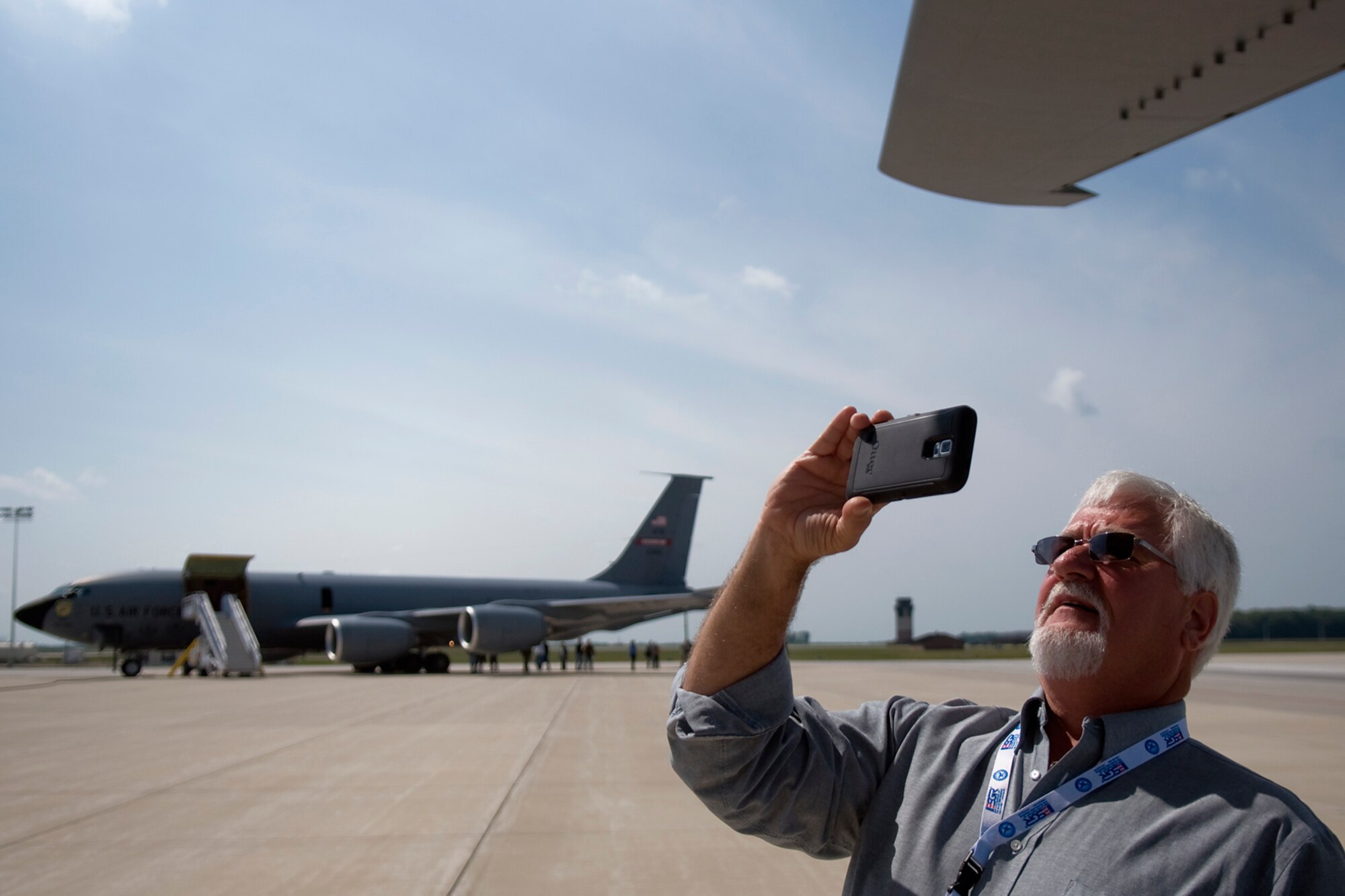 Gregory Carter, a truck driver with Wal-Mart, snaps a picture of a KC-135R Stratotanker aircraft from the Air Force Reserve's 434th Air Refueling Wing at Grissom Air Reserve Base, Ind., before taking off on a refueling mission Aug. 20, 2014. Indiana's two flying wings partnered together to fly 37 employers of guardsmen and reservists on a boss lift aimed at educating them about their employees' military service and responsibilities. (U.S. Air Force photo/Tech. Sgt. Mark R. W. Orders-Woempner) 
