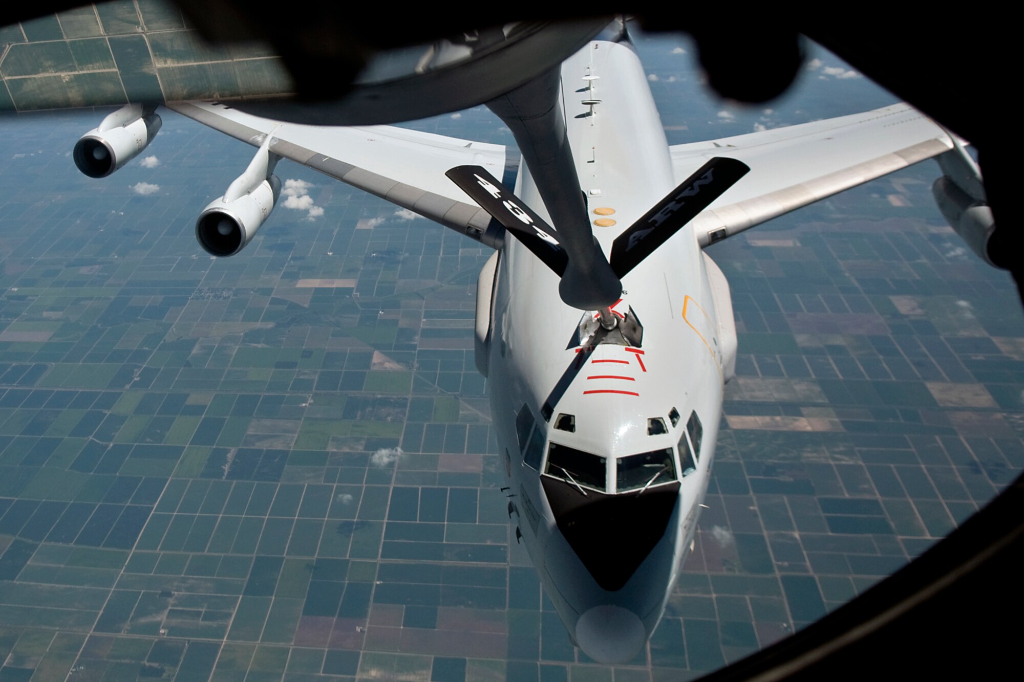 An E-3 Sentry Airborne Warning and Control System aircraft from Air Force Reserve's 513th Air Control Group at Tinker Air Force Base, Okla., refuels from a KC-135R Stratotanker aircraft from the Air Force Reserve's 434th Air Refueling Wing at Grissom Air Reserve Base, Ind., during a refueling mission over Illinois Aug. 20, 2014. Indiana's two flying wings partnered together to fly 37 employers of guardsmen and reservists on a boss lift aimed at educating them about their employees' military service and responsibilities. (U.S. Air Force photo/Tech. Sgt. Mark R. W. Orders-Woempner) 

