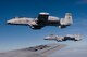 Two A-10 Thunderbolt II aircraft from the Air National Guard's 122nd Fighter Wing in Fort Wayne, Ind., fly off the wing of a KC-135R Stratotanker aircraft from the Air Force Reserve's 434th Air Refueling Wing at Grissom Air Reserve Base, Ind., during a refueling mission over the Hoosier state Aug. 20, 2014. Indiana's two flying wings partnered together to fly 37 employers of guardsmen and reservists on a boss lift aimed at educating them about their employees' military service and responsibilities. (U.S. Air Force photo/Tech. Sgt. Mark R. W. Orders-Woempner) 
