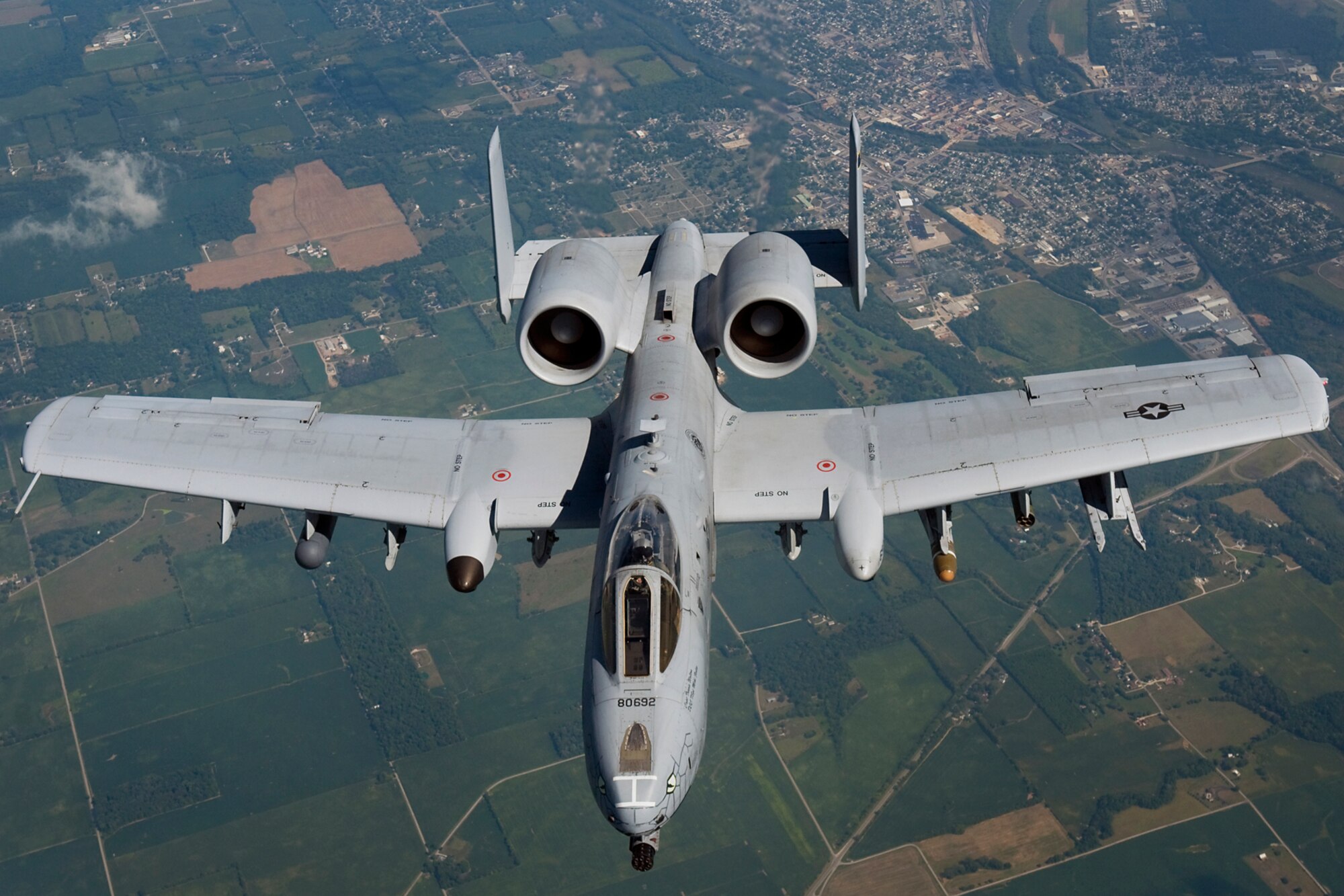 An A-10 Thunderbolt II aircraft from the Air National Guard's 122nd Fighter Wing in Fort Wayne, Ind., flies behind a KC-135R Stratotanker aircraft from the Air Force Reserve's 434th Air Refueling Wing at Grissom Air Reserve Base, Ind., during a refueling mission over the Hoosier state Aug. 20, 2014. Indiana's two flying wings partnered together to fly 37 employers of guardsmen and reservists on a boss lift aimed at educating them about their employees' military service and responsibilities. (U.S. Air Force photo/Tech. Sgt. Mark R. W. Orders-Woempner) 
