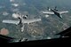 Two A-10 Thunderbolt II aircraft from the Air National Guard's 122nd Fighter Wing in Fort Wayne, Ind., fly behind a KC-135R Stratotanker aircraft from the Air Force Reserve's 434th Air Refueling Wing at Grissom Air Reserve Base, Ind., during a refueling mission over the Hoosier state Aug. 20, 2014. Indiana's two flying wings partnered together to fly 37 employers of guardsmen and reservists on a boss lift aimed at educating them about their employees' military service and responsibilities. (U.S. Air Force photo/Tech. Sgt. Mark R. W. Orders-Woempner) 
