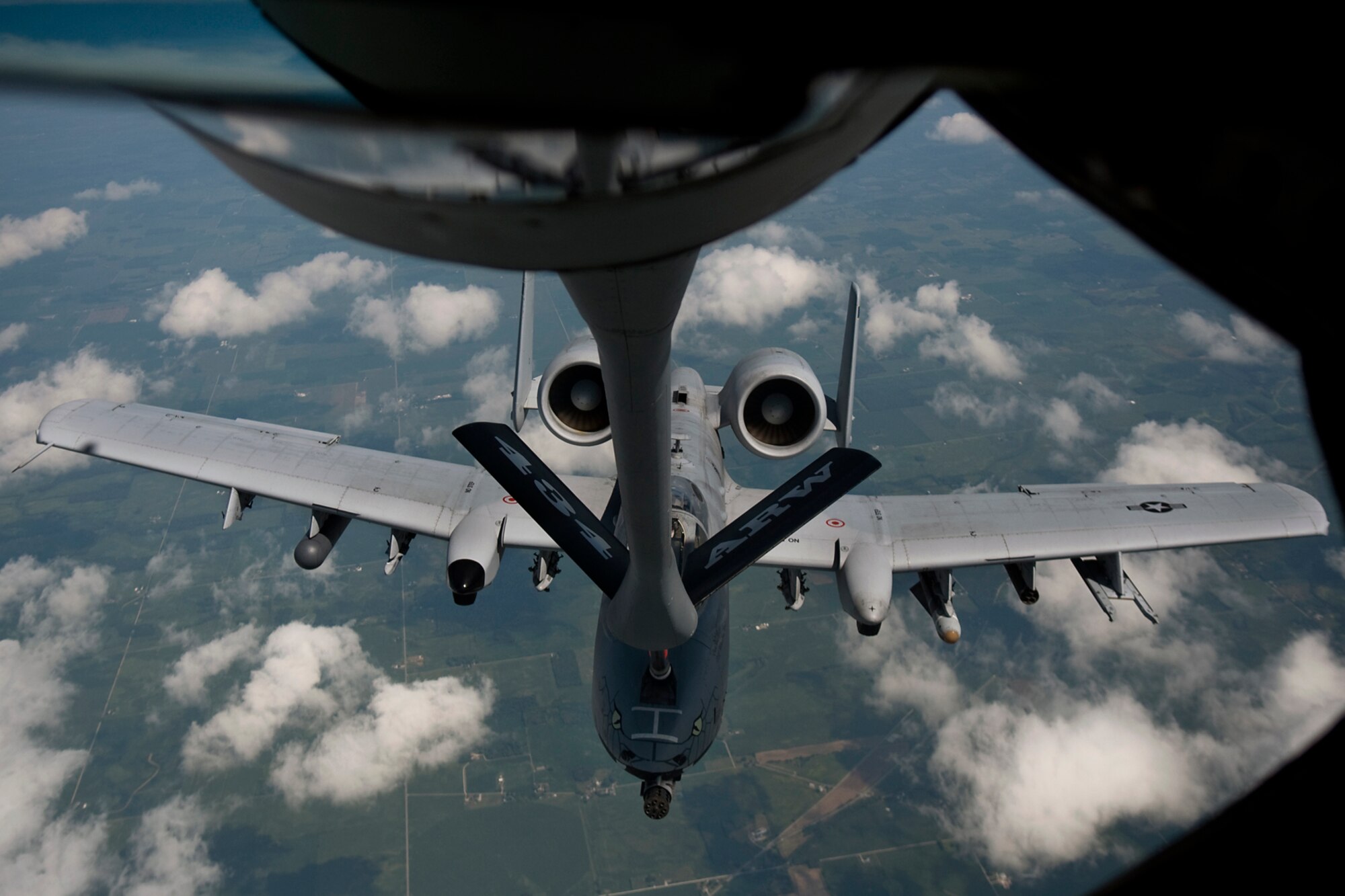 An A-10 Thunderbolt II aircraft from the Air National Guard's 122nd Fighter Wing in Fort Wayne, Ind., refuels from a KC-135R Stratotanker aircraft from the Air Force Reserve's 434th Air Refueling Wing at Grissom Air Reserve Base, Ind., during a refueling mission over the Hoosier state Aug. 20, 2014. Indiana's two flying wings partnered together to fly 37 employers of guardsmen and reservists on a boss lift aimed at educating them about their employees' military service and responsibilities. (U.S. Air Force photo/Tech. Sgt. Mark R. W. Orders-Woempner) 
