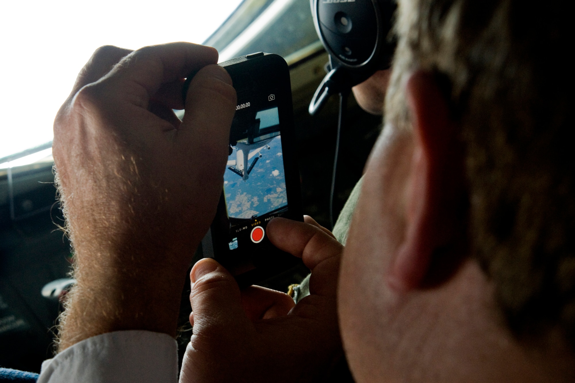 A reserve component employer captures video of an E-3 Sentry Airborne Warning and Control System aircraft from Air Force Reserve's 513th Air Control Group at Tinker Air Force Base, Okla., as it refuels from a KC-135R Stratotanker aircraft from the Air Force Reserve's 434th Air Refueling Wing at Grissom Air Reserve Base, Ind., during a refueling mission over Illinois Aug. 20, 2014. Indiana's two flying wings partnered together to fly 37 employers of guardsmen and reservists on a boss lift aimed at educating them about their employees' military service and responsibilities. (U.S. Air Force photo/Staff Sgt. Andrew McLaughlin) 
