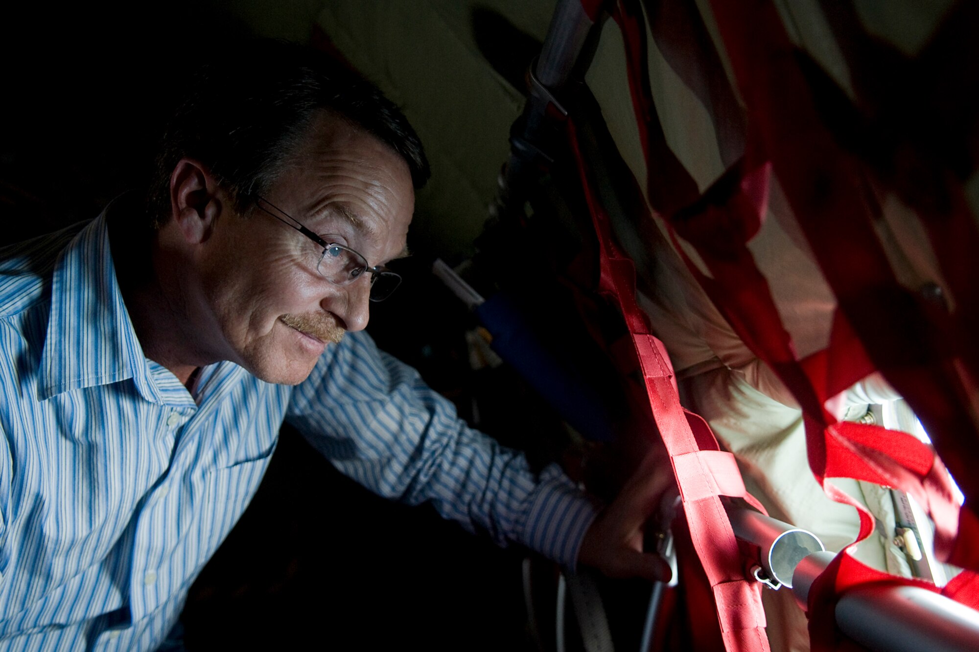 Bobby Baldwin, a supervisor with Accu-Read, looks out a window during a flight onboard a KC-135R Stratotanker aircraft from the Air Force Reserve's 434th Air Refueling Wing at Grissom Air Reserve Base, Ind., during a refueling mission over the Hoosier state Aug. 20, 2014. Indiana's two flying wings partnered together to fly 37 employers of guardsmen and reservists on a boss lift aimed at educating them about their employees' military service and responsibilities. (U.S. Air Force photo/Tech. Sgt. Mark R. W. Orders-Woempner) 
