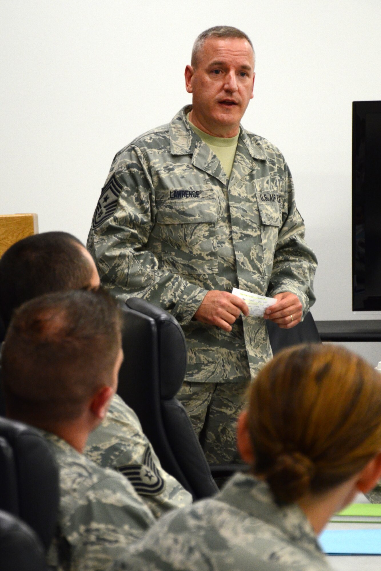 Command Chief Master Jamie Lawrence addresses 13 technical sergeants prior to beginning the Satellite NCO Academy course at Pease Air National Guard Base Aug. 26. Students enrolled in the course will spend Tuesday and Thursday nights through late November at Pease followed by a two week in-residence assignment at McGhee Tyson ANG Base, Tennessee. Technical sergeants have the option of attending the course in residence, correspondence and by satellite. (N.H. Air National Guard photo by Tech. Sgt. Mark Wyatt)
