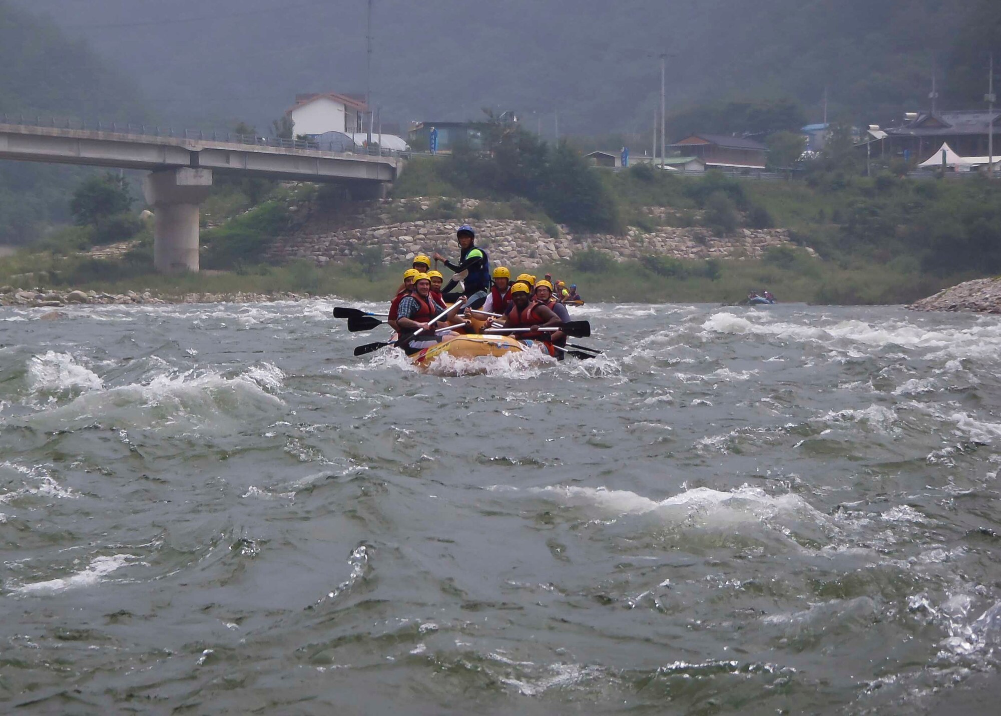 Airmen splash each other with water during a water rafting trip on the Naerincheon River, Republic of Korea, Aug. 23, 2014. The river stretches over 6 kilometers from Wondaegyo to the Gosari Resting Spot. (U.S. Air Force photo/Senior Airman David Owsianka)