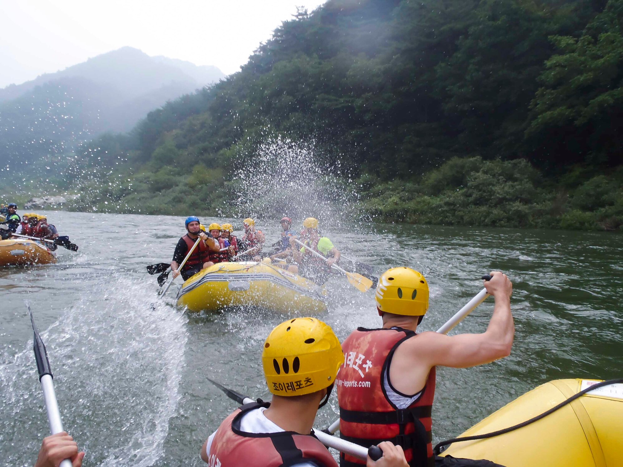 Airmen splash each other with water during a water rafting trip on the Naerincheon River, Republic of Korea, Aug. 23, 2014. The river stretches over 6 kilometers from Wondaegyo to the Gosari Resting Spot. (U.S. Air Force photo/Senior Airman David Owsianka)