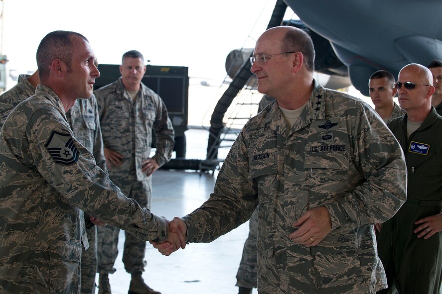 Lt. Gen. James Jackson, right, recognizes Master Sgt. James Hudson for his outstanding achievement as team chief of the Air Force Reserve’s first nuclear-certified B-52 weapons load crew, Aug. 26, 2014, at Barksdale Air Force Base, La. Jackson's visit to Barksdale included a tour of the 307th Bomb Wing and then attending the Air Reserve Component focus day hosted by the Air Force Global Strike Command. Jackson is the commander of Air Force Reserve Command. (U.S. Air Force photo/Master Sgt. Greg Steele)