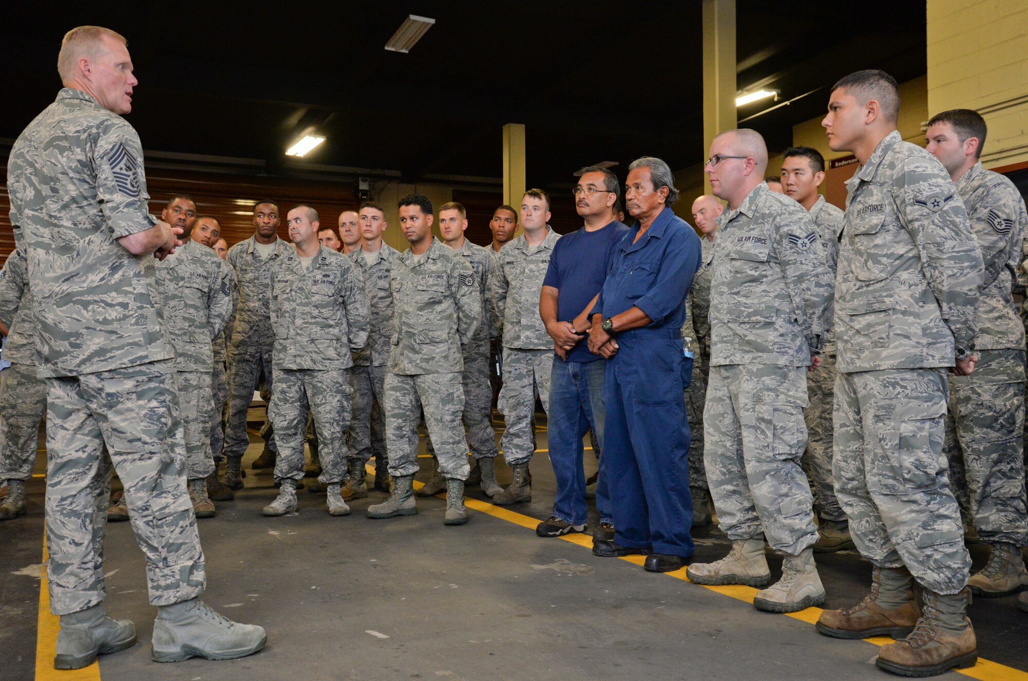 Chief Master Sgt. of the Air Force James A. Cody speaks to Airmen during a mission brief with the 36th Civil Engineering Squadron Aug. 25, 2014, at Andersen Air Force Base, Guam. Cody also toured the 36th Security Forces Squadron, 36th Medical Group and other squadrons on Andersen. (U.S. Air Force photo/Staff Sgt. Robert Hicks)