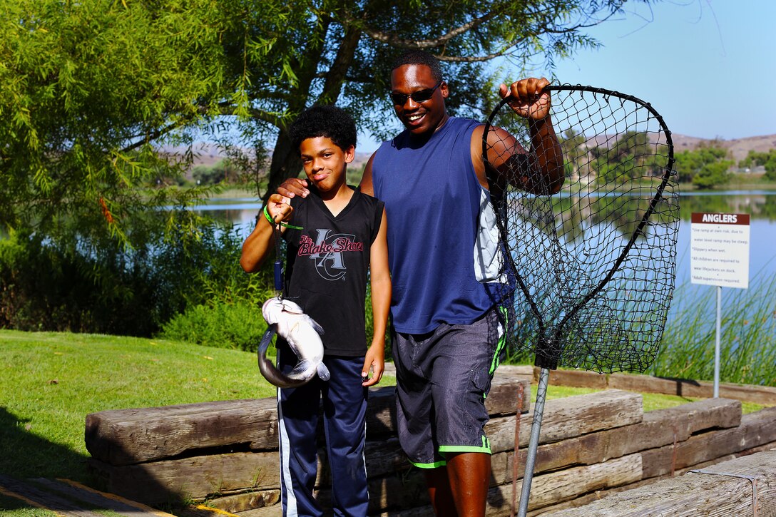 Thomas Jones, and his son Dejhaun, 10, caught an 18-inch Catfish weighing 4.09 lbs during the 9th annual Lake O'Neill Kids Fishing Derby, here, Sept. 6.

The fishing derby is a competition where children attempt to catch the largest fish they can while competing in three to five, six to 10 and 11 to 15 age categories.

"This event is designed to get kids out of the house where they can learn and have a fun outdoor experience," said Dolores Perez, a recreation specialist with Marine Corps Community Services' Semper Fit division. "I think this is a great way to keep them active and expose them to what could potentially be a new hobby."