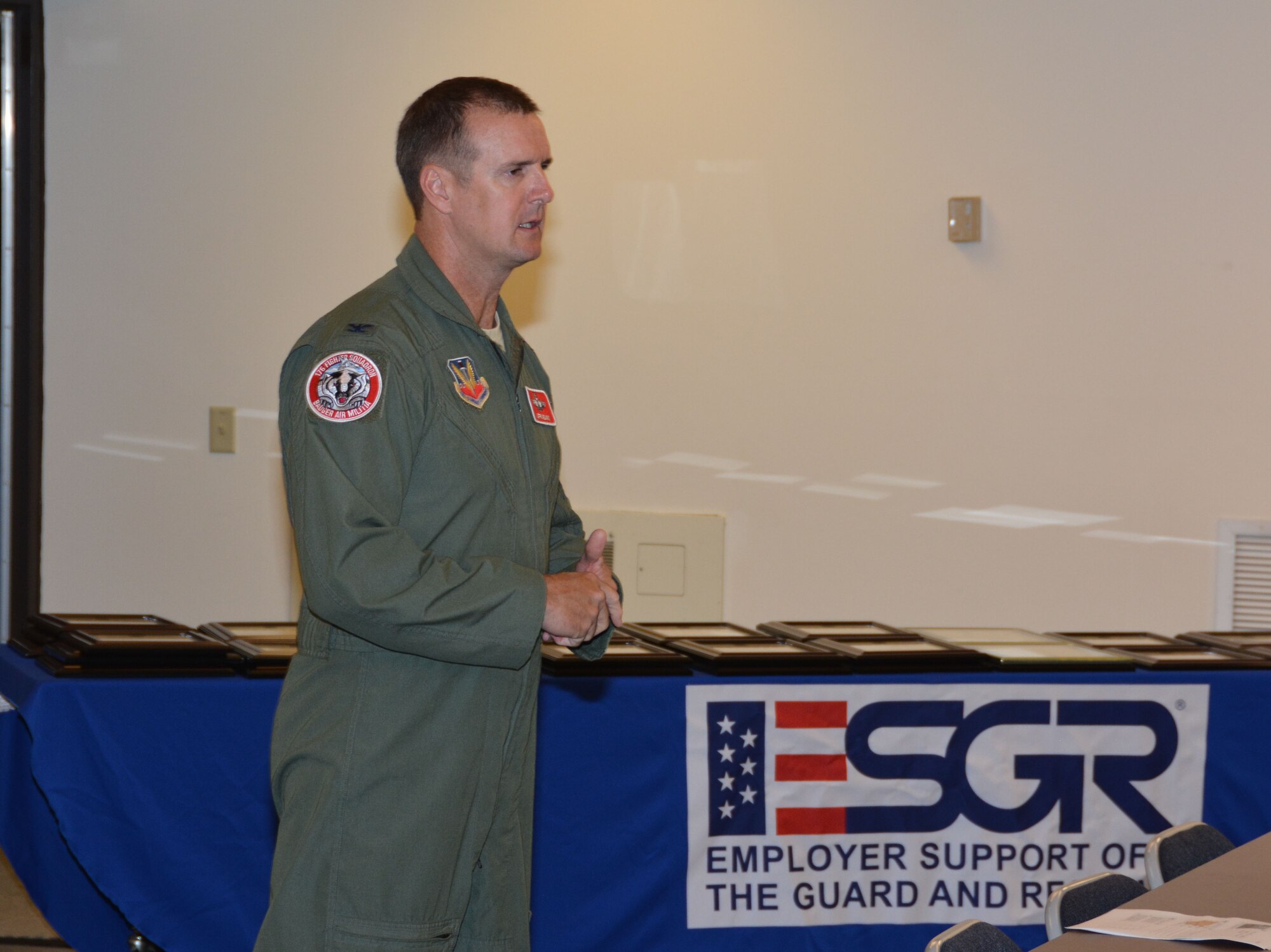 Col. Jeffrey Wiegand, 115 Fighter Wing commander, addressed approximately 70 employers and employees from the Madison area attended an Employer Support of the Guard and Reserve event Sept. 5 at the 115th FW, Madison, Wis.  Wiegand recognized employers who went above and beyond in their support of the Guard and Reserve members. (Air National Guard photo by Staff Sgt. Ryan Roth, released)