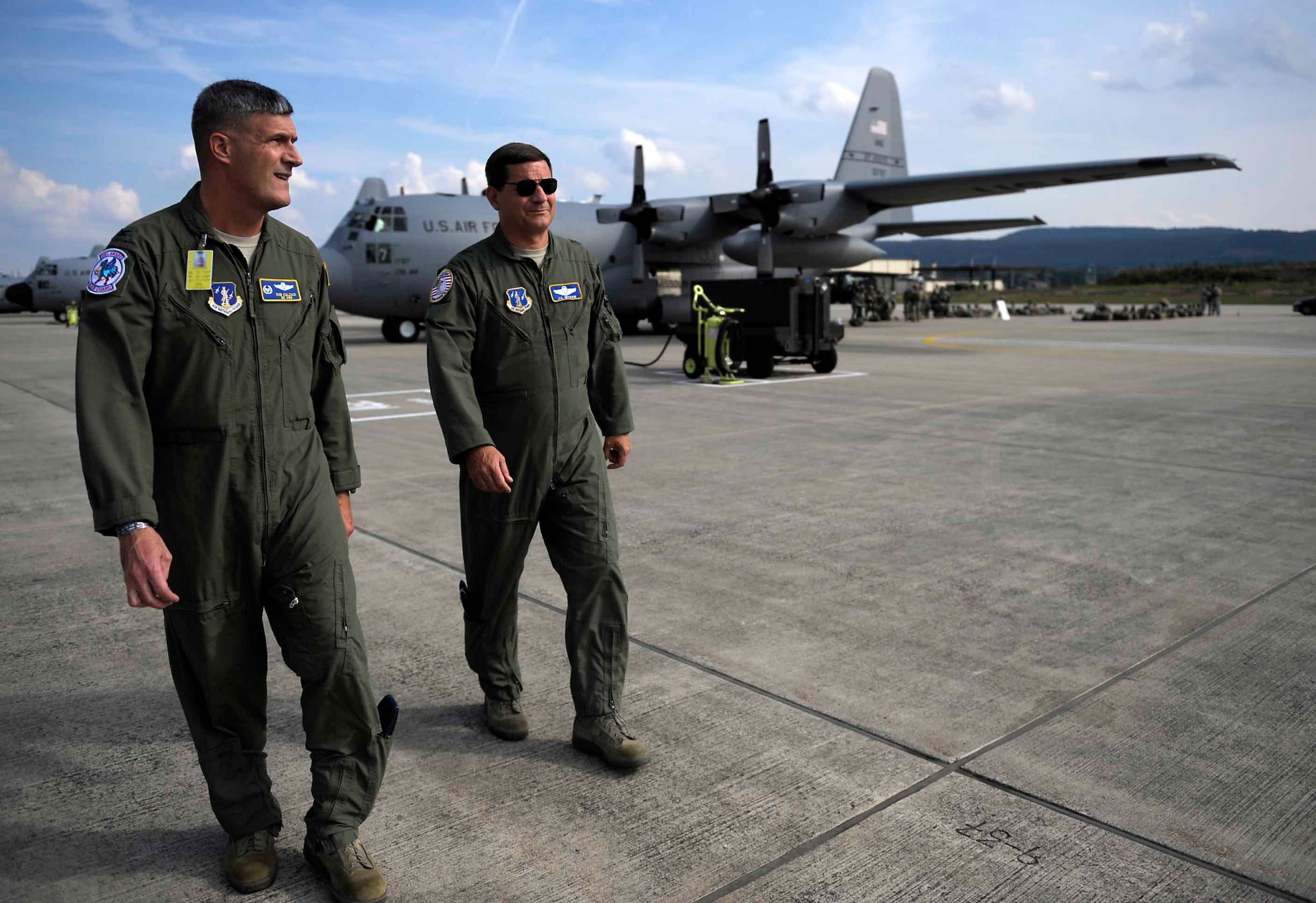 Brig. Gen. James C. Witham, U.S. Air National Guard deputy director, walks with Col. Robert Culcasi, 166th Operations Group commander, on the flightline during Steadfast Javelin II on Ramstein Air Base, Germany, Sept. 5, 2014. Active-duty and ANG aircraft are supporting Steadfast Javelin II by providing personnel air drop and air landings in support of forcible entry, force projection and reinforcing the joint commitment to Operation Atlantic Resolve, which demonstrates commitment to NATO Allies and security in Eastern Europe. (U.S. Air Force photo by Staff Sgt. Sara Keller)