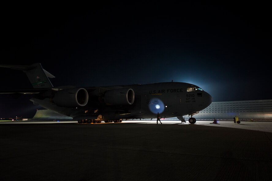 Aircrew from the 62nd Airlift Wing, Joint Base Lewis-McChord, Wash., perform post flight checks on a C-17 Globemaster III during Steadfast Javilen II, Ramstein Air Base, Germany, Sept. 5, 2014. Steadfast Javelin II prepares U.S., NATO Allies and European security partners to conduct unified land operations through the simultaneous combination of offensive, defensive, and stability operations appropriate to the mission and the environment, and to sustain interoperability with partner nations. (U.S. Air Force photo/Senior Airman Damon Kasberg) 

