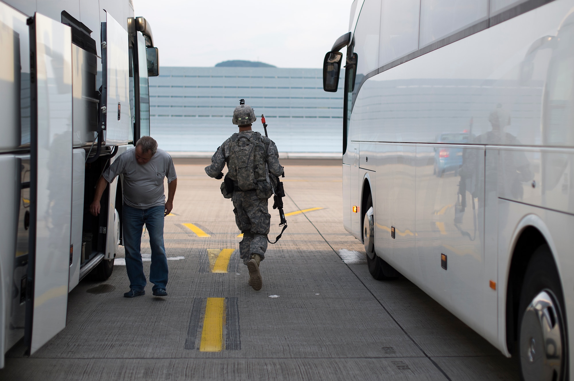 A Soldier assigned to Apache Troop, 1st Squadron, 2nd Cavalry Regiment runs to catch up with the rest of his team during Steadfast Javelin II on Ramstein Air Base, Germany, Sept. 5, 2014. Steadfast Javelin II prepares U.S., NATO Allies and European security partners to conduct unified land operations through the simultaneous combination of offensive, defensive, and stability operations appropriate to the mission and the environment, and to sustain interoperability with partner nations. (U.S. Air Force photo/Senior Airman Damon Kasberg)