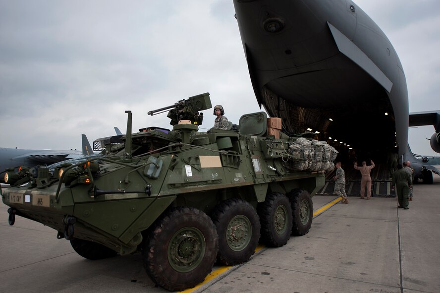 A U.S. Army Stryker assigned to the 2nd Cavalry Regiment, off loads from a C-17 Globemaster III in support of Steadfast Javelin II on Ramstein Air Base, Germany, Sept. 4, 2014. Steadfast Javelin II is a NATO exercise involving over 2,000 troops and takes place across Estonia, Germany, Latvia, Lithuania and Poland. The exercise focuses on increasing interoperability and synchronizing complex operations between allied air and ground forces through airborne and air assault missions. (U.S. Air Force photo/Senior Airman Damon Kasberg)