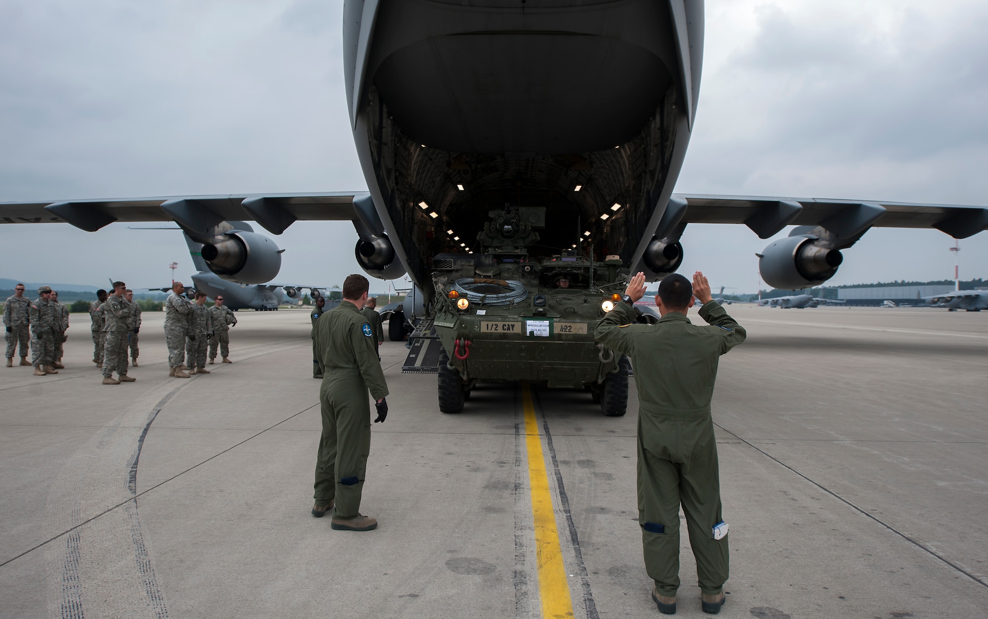Loadmasters assigned to the 7th Airlift Squadron load a U.S. Army Strykers from the 2nd Cavalry Regiment into a C-17 Globemaster III during Steadfast Javelin II, Ramstein Air Base, Germany, Sept. 2, 2014. The exercise, Steadfast Javelin II, features a number of dynamic events designed to challenge the multi-national forces in airborne operations, conventional warfare scenarios as well as stability and defensive operations, and support of civil authorities operations. (U.S. Air Force photo/Senior Airman Damon Kasberg)