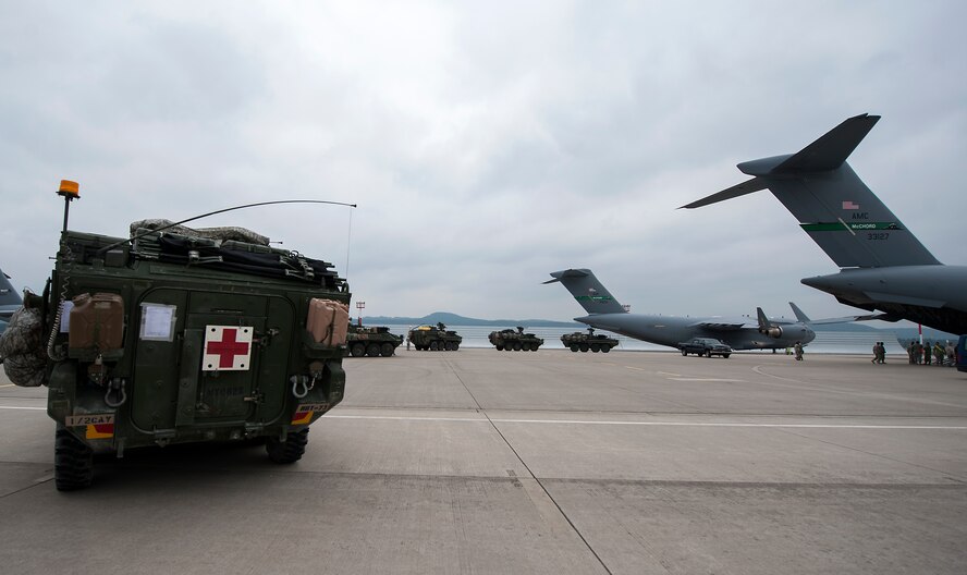 U.S. Army Strykers assigned to the 2nd Cavalry Regiment prepare to load into C-17 Globemaster IIIs in support of Steadfast Javelin II on Ramstein Air Base, Germany, Sept. 4, 2014. Steadfast Javelin II is a NATO exercise involving over 2,000 troops and takes place across Estonia, Germany, Latvia, Lithuania and Poland. The exercise focuses on increasing interoperability and synchronizing complex operations between allied air and ground forces through airborne and air assault missions. (U.S. Air Force photo/Senior Airman Damon Kasberg)