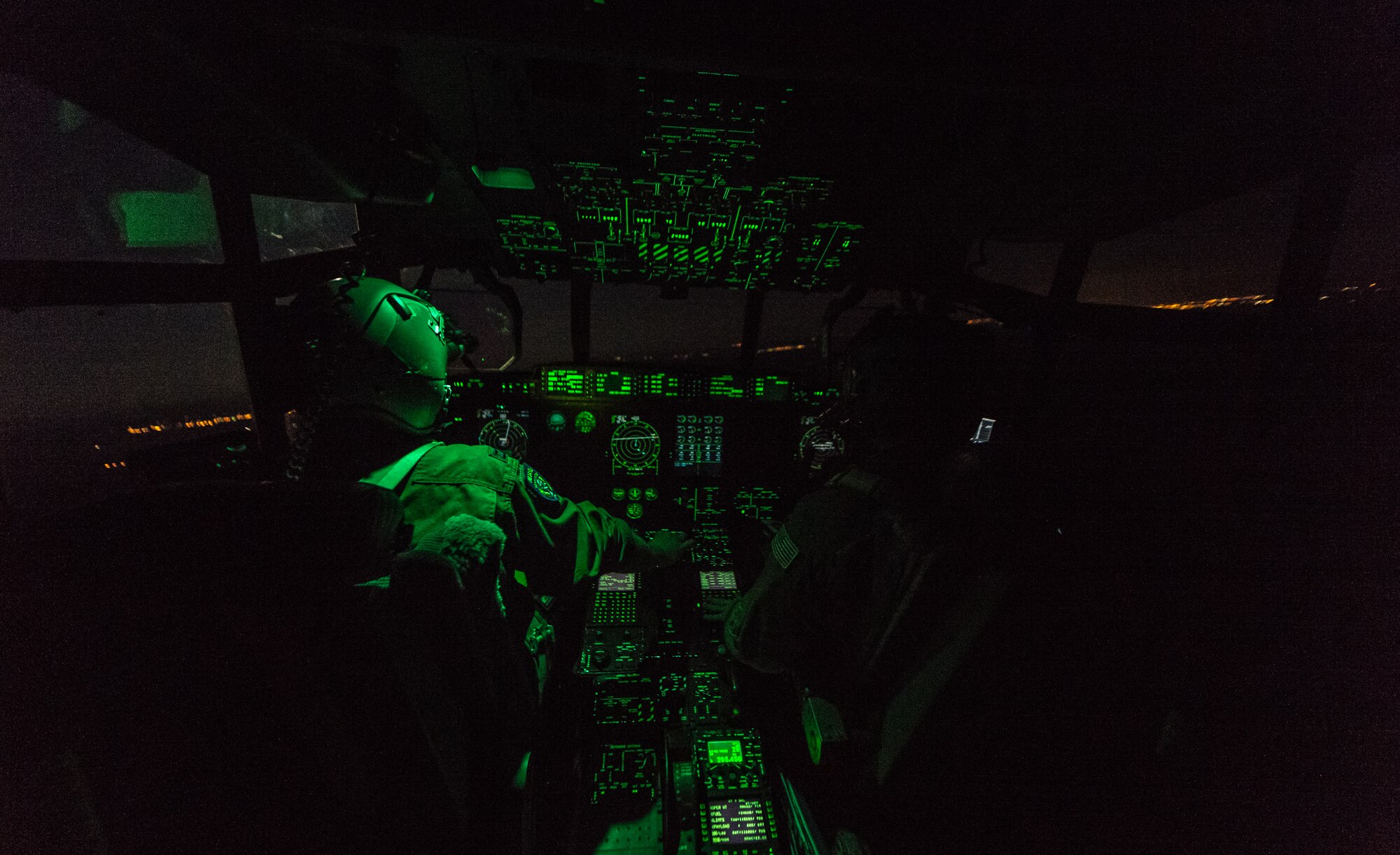 U.S. Air Force Capt. Scott Vander Ploeg, left, and 1st Lt. Trey Cecil, 37th Airlift Squadron pilots fly a 37th AS C-130J Super Hercules during an airdrop of paratroopers from the 1st Battalion, 503rd Infantry Regiment, 173rd Airborne Brigade during exercise Steadfast Javelin II over Lithuania, Sept. 5, 2014. The exercise prepares U.S., NATO Allies and European security partners to conduct unified land operations through the simultaneous combination of offensive, defensive, and stability operations appropriate to the mission and the environment, and to sustain interoperability with partner nations. (U.S. Air Force photo/Airman 1st Class Jordan Castelan)