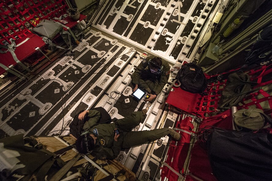 U.S. Air Force Airman 1st Class Emily Mitchell and Senior Airman Christian McDevitt, 37th Airlift Squadron loadmasters, wait to airdrop paratroopers with the 1st Battalion, 503rd Infantry Regiment, 173rd Airborne Brigade in a 37th AS C-130J Super Hercules during exercise Steadfast Javelin II over Poland, Sept. 5, 2014. The exercise sustains interoperability between NATO Allies and Partnership for Peace partner nation forces.  The interoperability has been gained during combat and multinational contingency operations over the past seven decades, while focusing on building capacity for the current and future operational environment. (U.S. Air Force photo/Airman 1st Class Jordan Castelan)