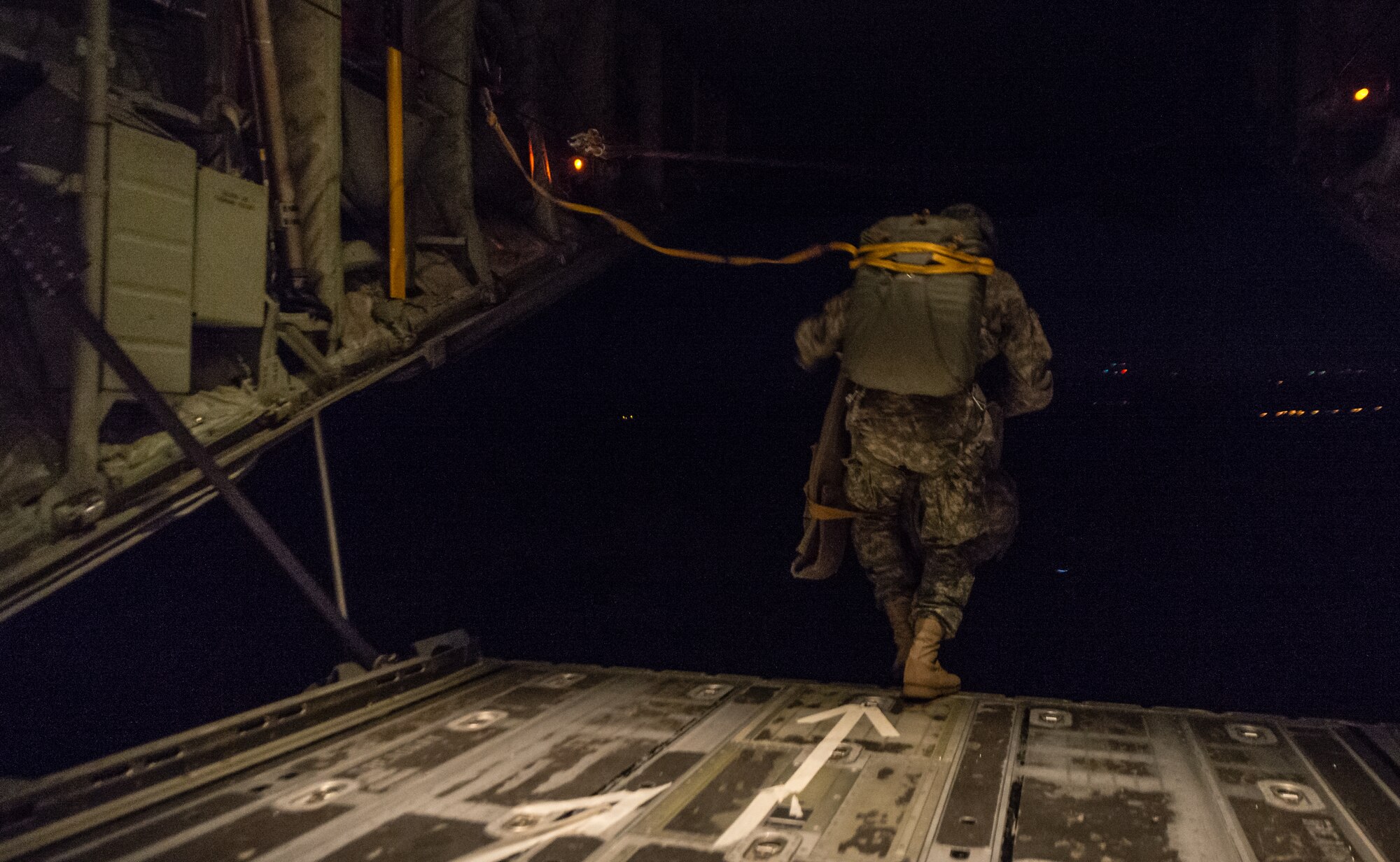 A U.S. Army paratrooper with the 1st Battalion, 503rd Infantry Regiment, 173rd Airborne Brigade, exits a 37th Airlift Squadron C-130J Super Hercules during an airdrop as part of exercise Steadfast Javelin II over Lithuania, Sept. 5, 2014, The exercise sustains interoperability between NATO Allies and Partnership for Peace partner nation forces.  The interoperability has been gained during combat and multinational contingency operations over the past seven decades, while focusing on building capacity for the current and future operational environment. (U.S. Air Force photo/Airman 1st Class Jordan Castelan)