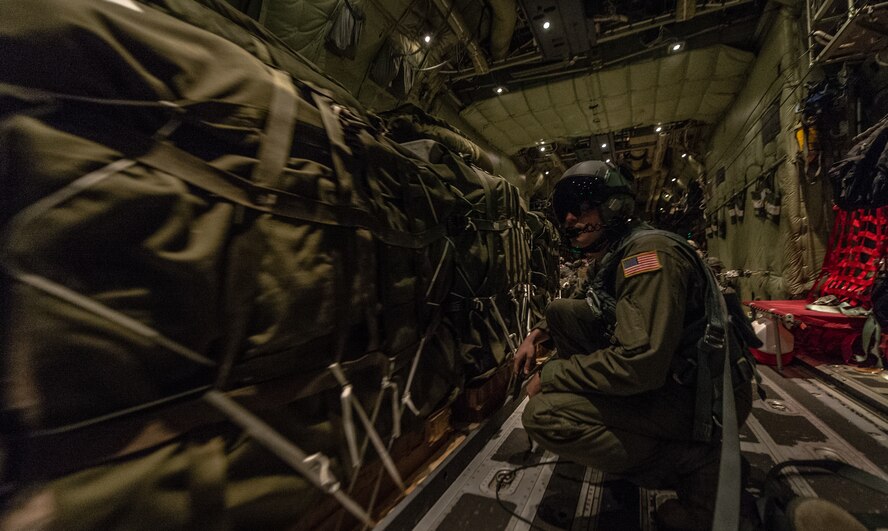 U.S. Air Force Senior Airman Christian McDevitt, 37th Airlift Squadron loadmaster releases a load of cargo inside a 37th AS C-130J Super Hercules during exercise Steadfast Javelin II over Lithuania, Sept. 5, 2014. The exercise prepares U.S., NATO Allies and European security partners to conduct unified land operations through the simultaneous combination of offensive, defensive, and stability operations appropriate to the mission and the environment, and to sustain interoperability with partner nations. (U.S. Air Force photo/Airman 1st Class Jordan Castelan)