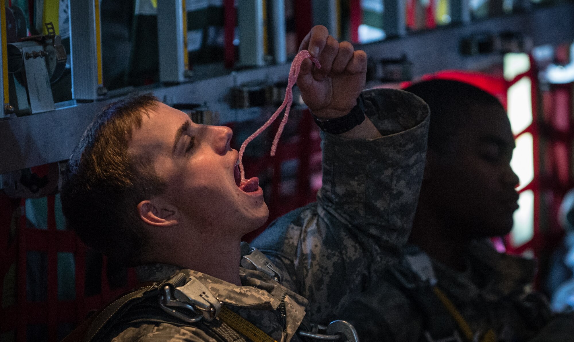 U.S. Army Pvt. Donald Dunigan, a paratrooper with the 1st Battalion, 503rd Infantry Regiment, 173rd Airborne Brigade, has a snack during a flight on a 37th Airlift Squadron C-130J Super Hercules before being air dropped into Lithuania, Sept. 5, 2014, over Germany. The exercise prepares U.S., NATO Allies and European security partners to conduct unified land operations through the simultaneous combination of offensive, defensive, and stability operations appropriate to the mission and the environment, and to sustain interoperability with partner nations. (U.S. Air Force photo/Airman 1st Class Jordan Castelan)