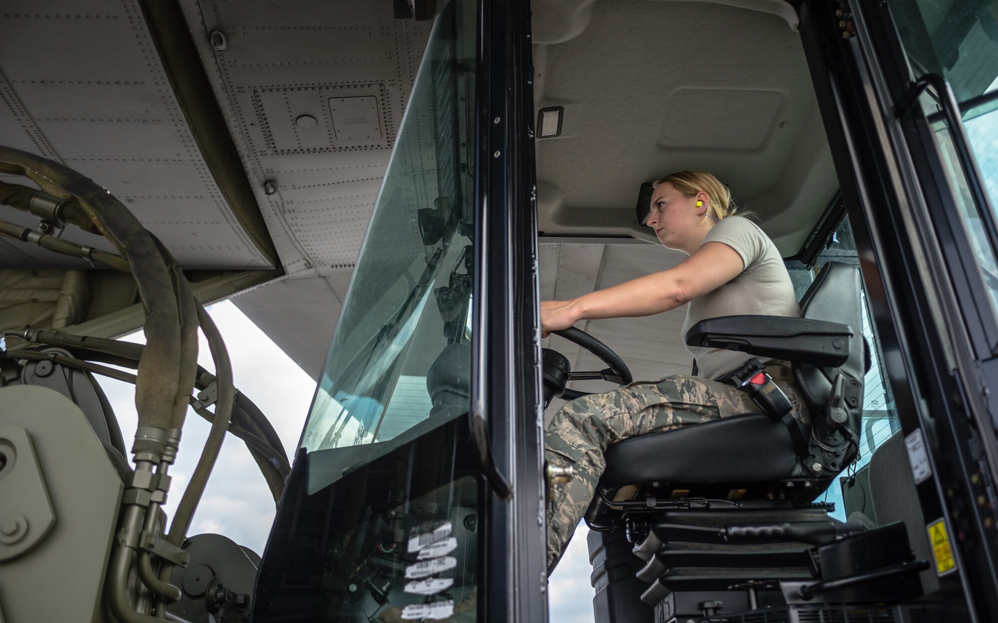 U.S. Air Force Airman 1st Class Chelsea Nibert, 86th Logistic Readiness Squadron aerial delivery specialist, drives a load of cargo onto a 37th Airlift Squadron C-130J Super Hercules before paratroopers with the 1st Battalion, 503rd Infantry Regiment, 173rd Airborne Brigade are airlifted during exercise Steadfast Javelin II on Ramstein Air Base, Germany, Sept. 5, 2014. The U.S. Air Force and Air National Guard support Steadfast Javelin II by providing personnel air drop and air landings in support of forcible entry and force projection,  reinforcing the joint commitment to Operation Atlantic Resolve, and a  demonstrated commitment to our NATO Allies and security in Eastern Europe. (U.S. Air Force photo/Airman 1st Class Jordan Castelan)