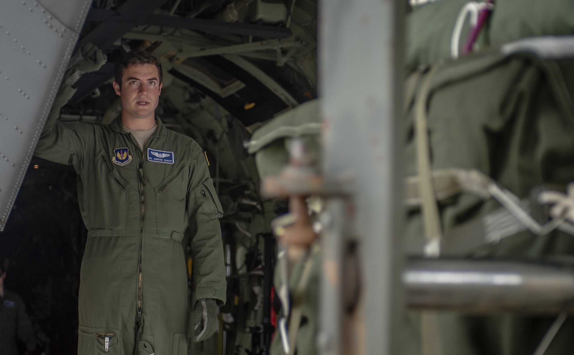 U.S. Air Force Senior Airman Christian McDevitt, 37th Airlift Squadron loadmaster, marshals in load of cargo onto a 37th AS C-130J Super Hercules before airlifting paratroopers with the 1st Battalion, 503rd Infantry Regiment, 173rd Airborne Brigade during exercise Steadfast Javelin II on Ramstein Air Base, Germany, Sept. 5, 2014. The exercise prepares U.S., NATO Allies and European security partners to conduct unified land operations through the simultaneous combination of offensive, defensive, and stability operations appropriate to the mission and the environment, and to sustain interoperability with partner nations. (U.S. Air Force photo/Airman 1st Class Jordan Castelan)
