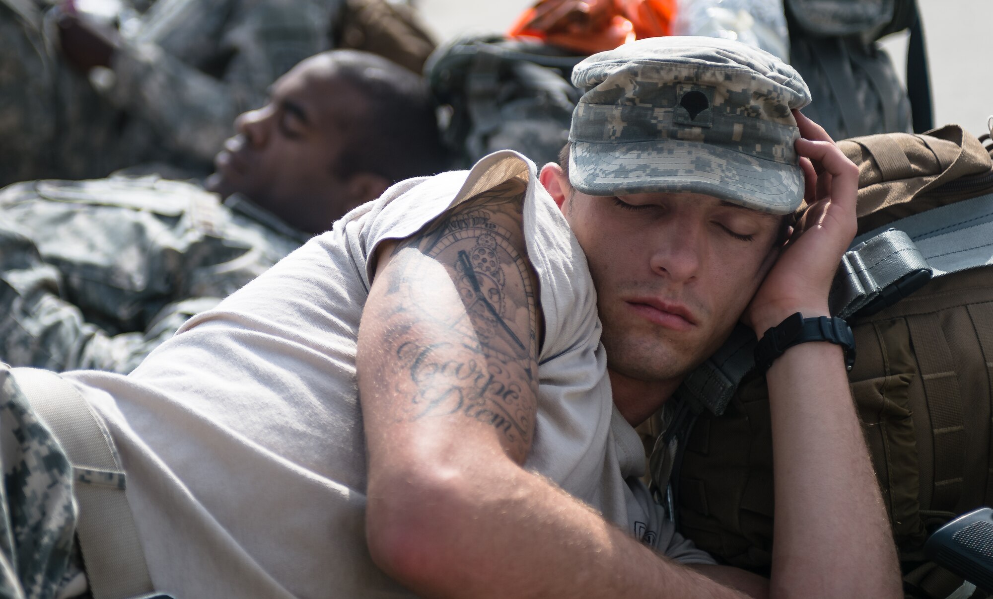 U.S. Army Spc. David Perales, a paratrooper with the 1st Battalion, 503rd Infantry Regiment, 173rd Airborne Brigade sleeps before loading into a C-130J Super Hercules during exercise Steadfast Javelin II on Ramstein Air Base, Germany, Sept. 5, 2014. The exercise prepares U.S., NATO Allies and European security partners to conduct unified land operations through the simultaneous combination of offensive, defensive, and stability operations appropriate to the mission and the environment and to sustain interoperability with partner nations. (U.S. Air Force photo/Airman 1st Class Jordan Castelan)