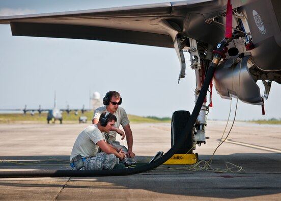 Staff Sgt.s Todd Bedo and Wayne Singleton, 33rd Fighter Wing, monitor a laptop connected to an F-35A Lightning II during post flight checks after the aircraft landed at Duke Field, Fla.  The maintainers, typically stationed at Eglin Air Force Base, were there to support the aircraft before and after a joint multi-wing major accident response exercise.  (U.S. Air Force photo/Tech. Sgt. Sam King)