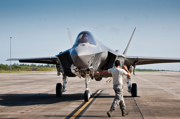 Staff Sgt. Wayne Singleton, 33rd Fighter Wing, marshals in an F-35A Lightning II at Duke Field, Fla.  The maintainers, typically stationed at Eglin Air Force Base, were there to support the aircraft before and after a joint multi-wing major accident response exercise.  (U.S. Air Force photo/Tech. Sgt. Sam King)