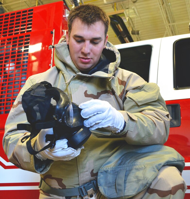 Staff Sgt. Fred Moreton, member of the 146th ASOS, prepares his gas mask for an exercise during CBRNE training Sept. 7.  The 146th ASOS attended the last CBRNE training before a new format will be implemented in October. (Official Air Force photo by Airman 1st Class Brigette Waltermire/Released)   