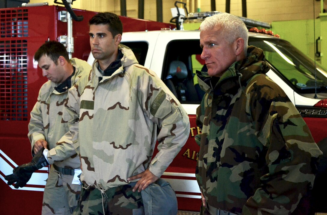 Tech. Sgt. Larry Mansell, a member of the 146th ASOS (middle), and Lt. Col. James Waltermire, commander of the 146th ASOS (right), participate in CBRNE training Sept. 7.  The 146th ASOS attended the last CBRNE training before a new format will be implemented in October.  (Official Air Force photo by Airman 1st Class Brigette Waltermire/Released)   