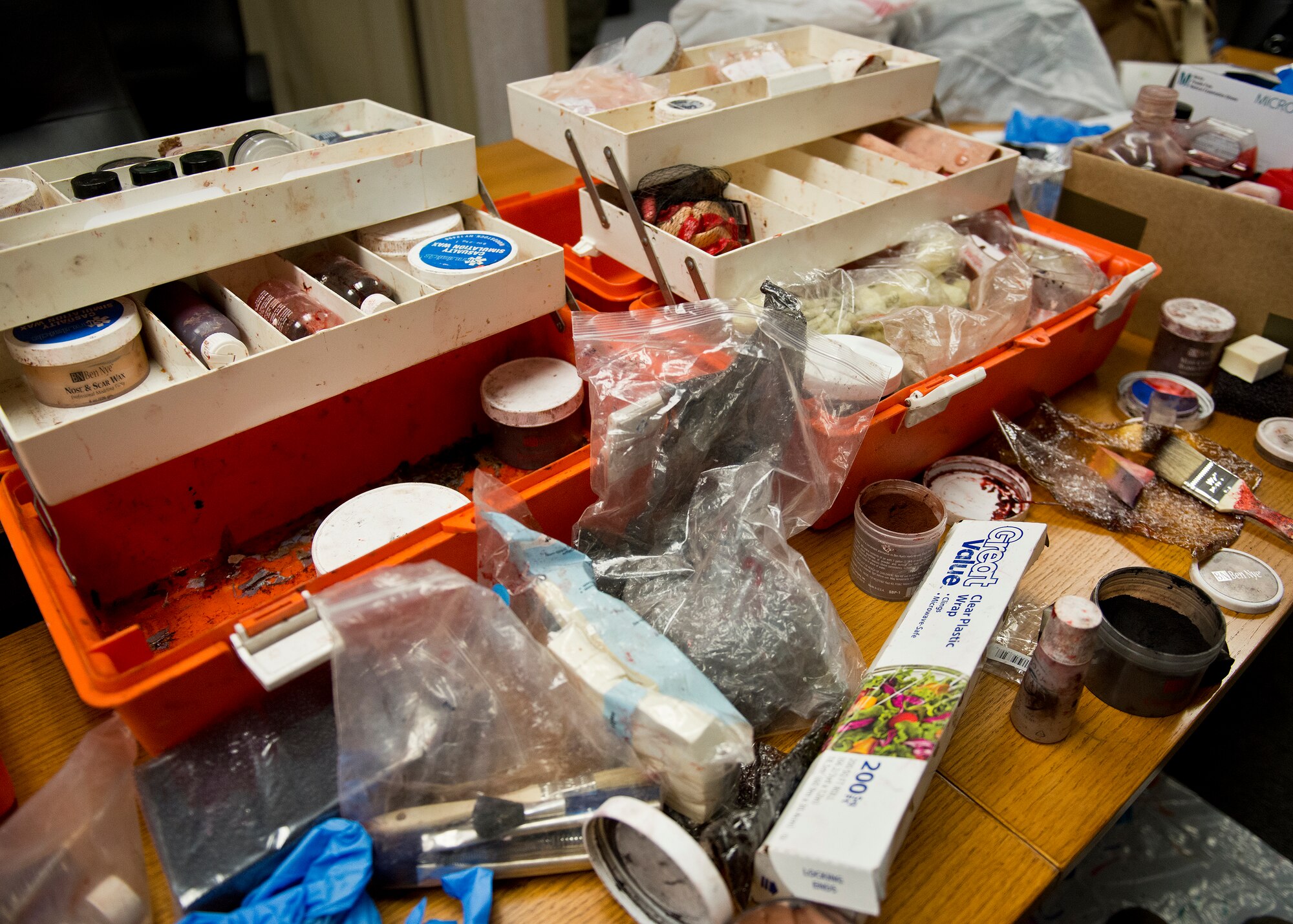 The 96th Medical Group’s moulage team’s equipment is spread out across a table as Airmen create realistic victims for an exercise at Duke Field. The 96th MDG’s team of six Airmen provides a sense of realism in exercises that medics and first responders may encounter in real-world accidents. (U.S. Air Force photo/Tech. Sgt. Jasmin Taylor)