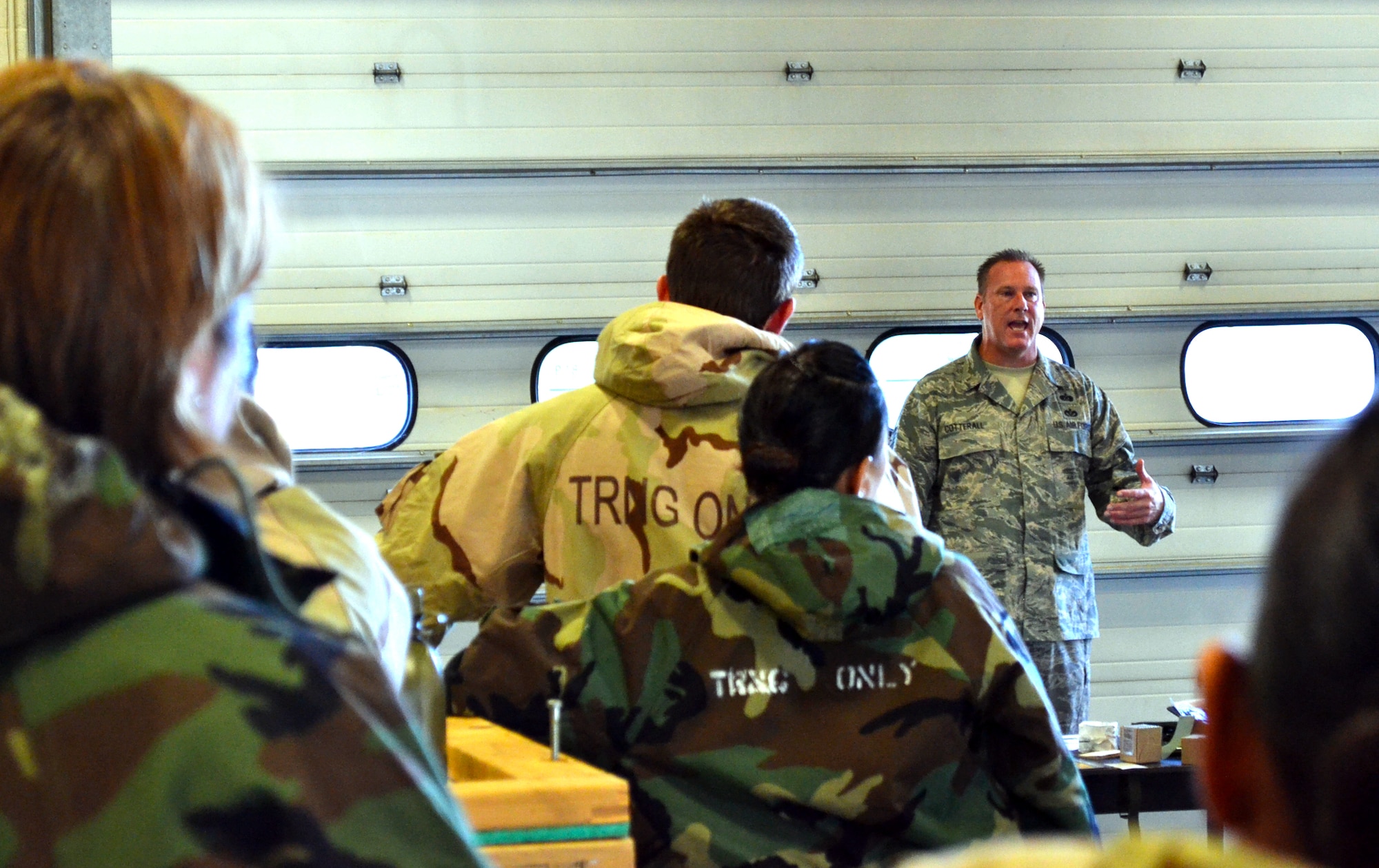 Members of the 146th Air Support Operations Squadron listen as Tech. Sgt. Timothy Coterall, CBRNE instructor for the 137th ARW, teaches the last class using the old training format Sept. 7.  A new training format is scheduled to premier in October. (Official Air Force photo by Airman 1st Class Brigette Waltermire/Released)   