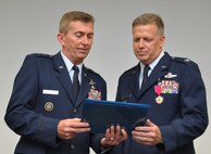 Col. Robert Mortensen, deputy director operations and plans at Tenth Air Force, retires from duty during a ceremony Sep. 6, 2014, Naval Air Station Fort Worth Joint Reserve Base, Texas. He previously served as vice-commander of the 301st Fighter Wing from 2008 to 2010. (U.S. Air Force photo by Staff Sgt. Samantha Mathison)