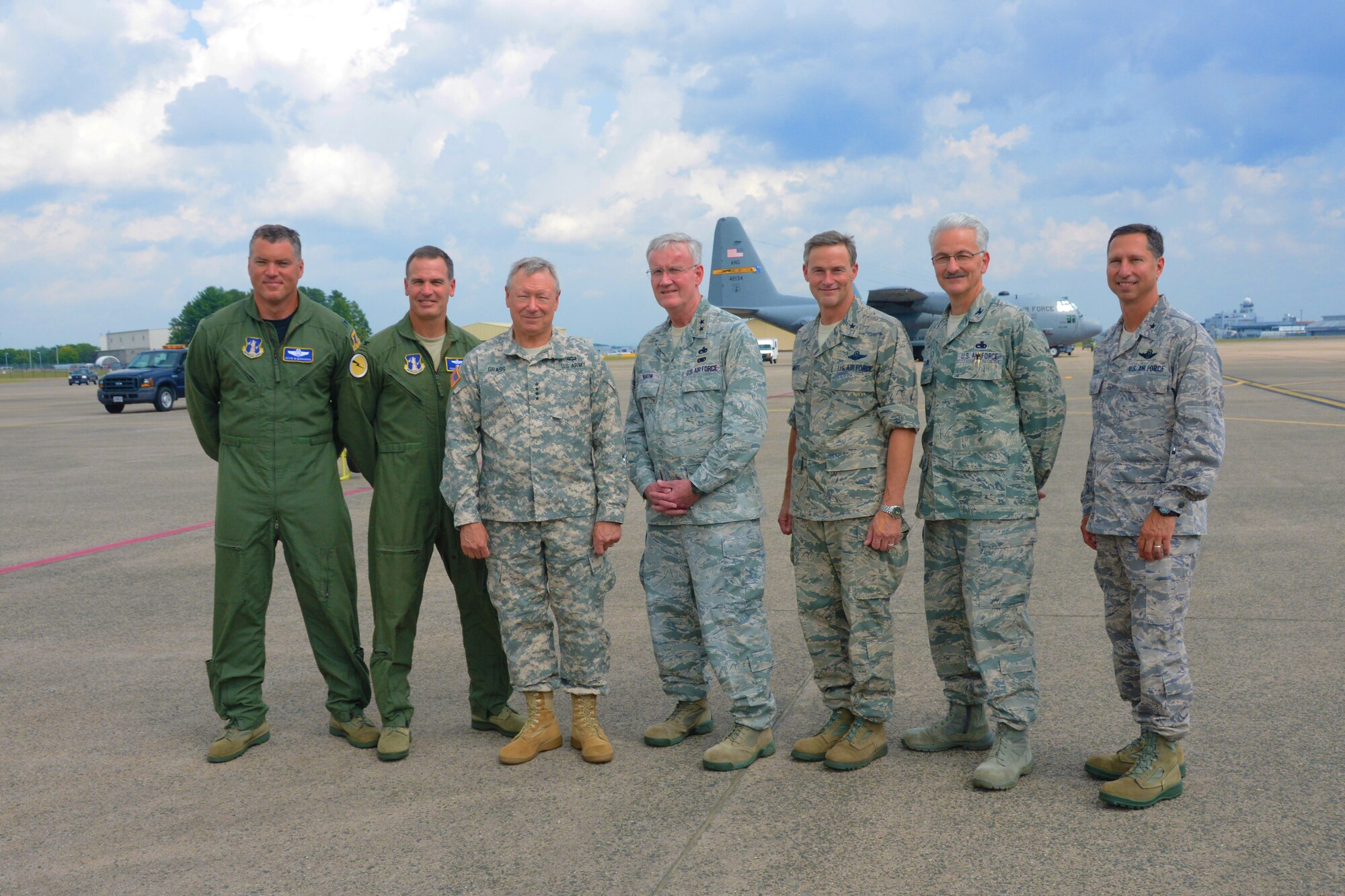 Col. Kevin McManaman, Col. Frank Detorie, Gen. Frank J. Grass, Maj. Gen. Thad Martin, Brig. Gen. Jon Mott, Col. Frederick Miclon, and Brig. Gen. Peter Siana, (left to right) pose in front of a C-130H Hercules aircraft assigned to the 103rd Airlift Wing Sept. 6, 2014 at Bradley Air National Guard Base, East Granby, Conn. Grass toured the base and met with Conn. Airmen during a town hall meeting. (U.S. Air National Guard photo by Senior Airman Jennifer Pierce)