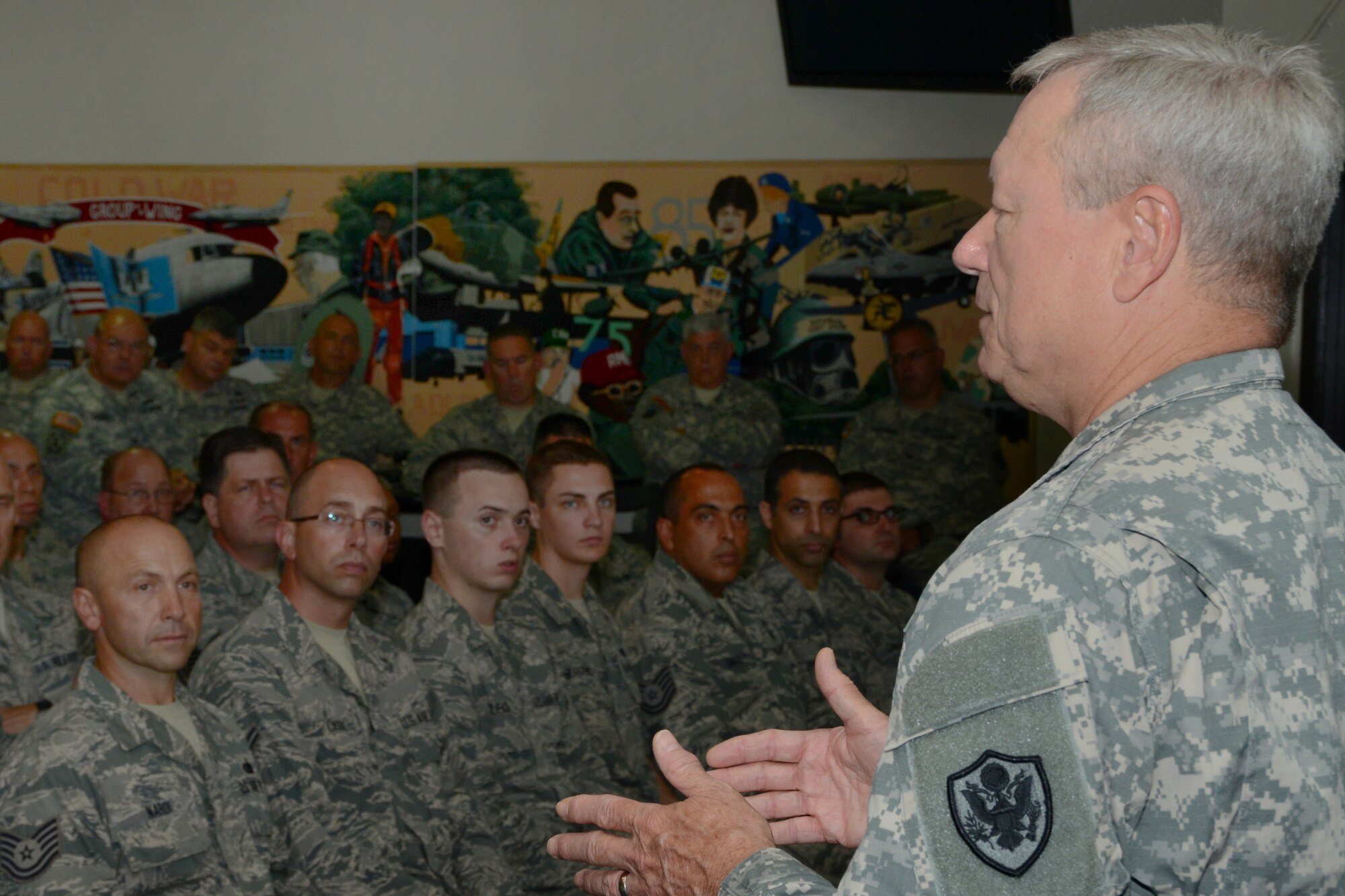 Chief of the National Guard Bureau General Frank J. Grass conducts a town hall meeting, emphasizing the importance of being in the Guard for Airmen at Bradley Air National Guard Base, East Granby, Conn, Sept. 9, 2014. This was the first time a Chief of the National Guard Bureau visited the Flying Yankees. (U.S. Air National Guard photo by Senior Airman Emmanuel Santiago)