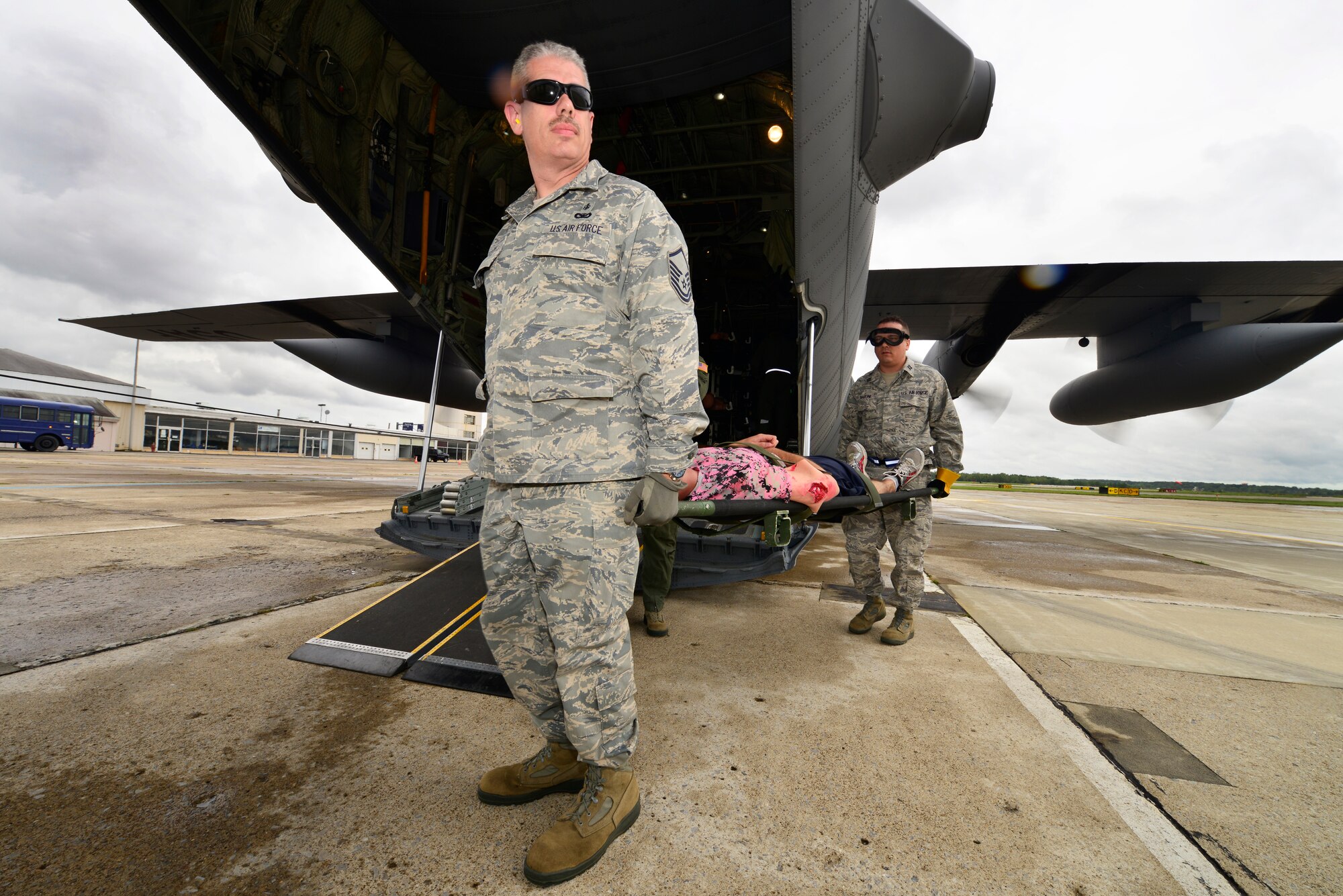 Master Sgt. Joseph Heath, 914th Aeromedical Staging Squadron, prepares to carry a victim on a litter during Operation Cold Front, here at Niagara Falls Air Reserve Station, September 6, 2014.This exercise serves as an opportunity to evaluate participants on their ability to respond to operational needs and demonstrate mission execution capabilities.  (U.S. Air Force photo by Staff Sgt. Stephanie Clark)