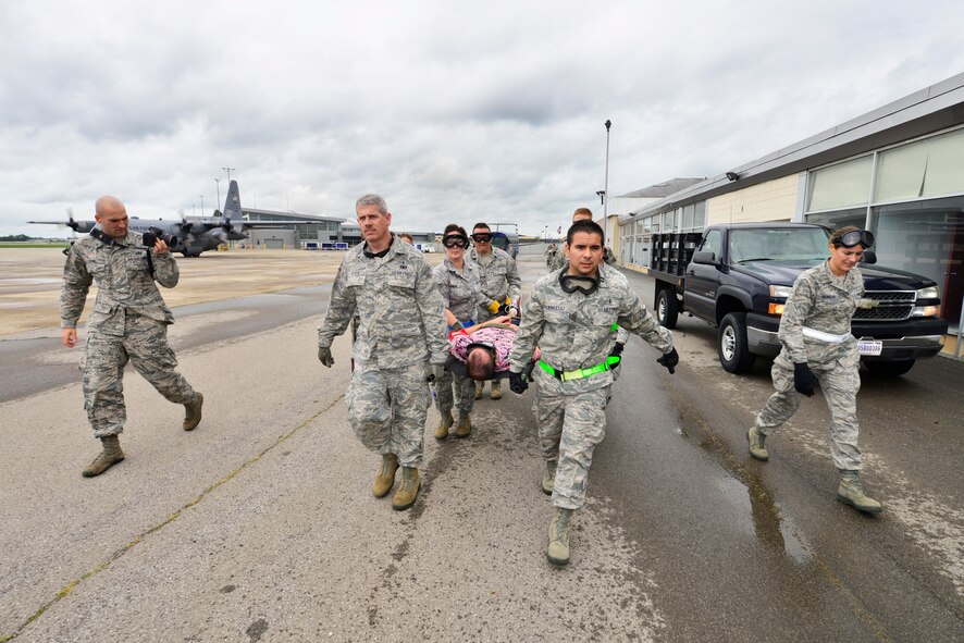 Members of the 914th Aeromedical Staging Squadron participate in Operation Cold Front, here at Niagara Falls Air Reserve Station, N.Y., September 6, 2014. This exercise serves as an opportunity to evaluate participants on their ability to respond to operational needs and demonstrate mission execution capabilities.  (U.S. Air Force photo by Staff Sgt. Stephanie Clark)
