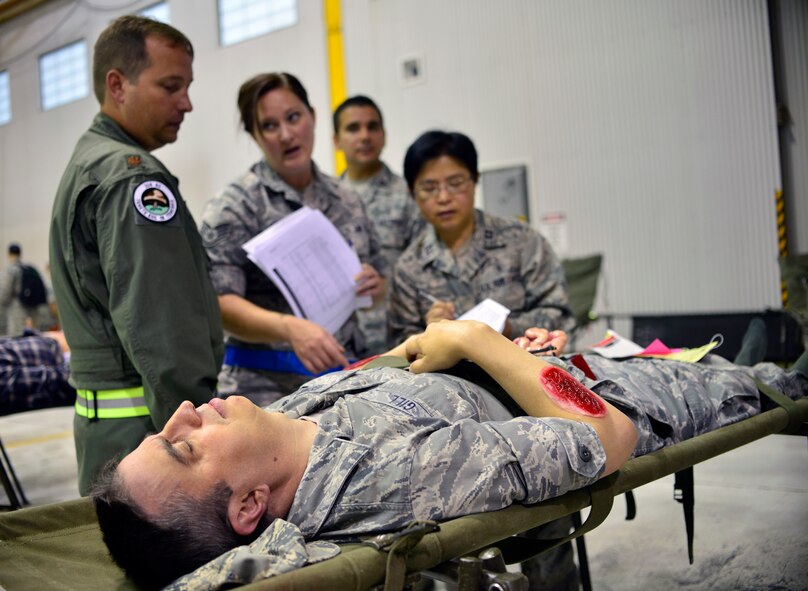 Members of the 914th Aeromedical Staging Squadron participate in Operation Cold Front, here at Niagara Falls Air Reserve Station, N.Y., September 6, 2014. This exercise serves as an opportunity to evaluate participants on their ability to respond to operational needs and demonstrate mission execution capabilities.  (U.S. Air Force photo by Staff Sgt. Stephanie Clark)