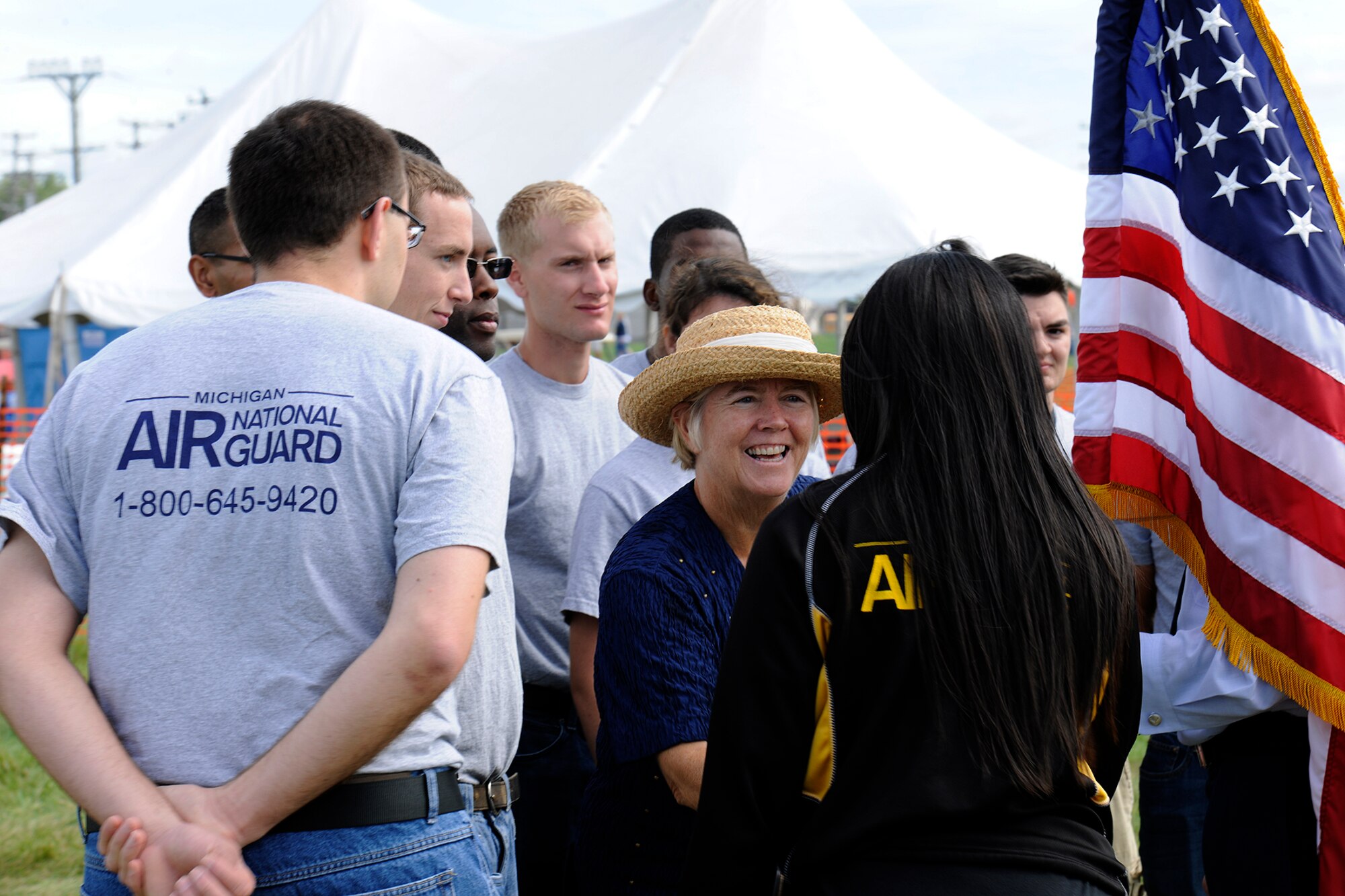 U.S. Rep. Candice Miller (R-Michigan) congratulates new enlistees in the Michigan Air National Guard moments after they were sworn in during a ceremony at the 2014 Selfridge Open House & Air Show, Sept. 6, 2014. The new Airmen will serve in various capacities in the 1,700-member 127th Wing, which is based at Selfridge Air National Guard Base, Mich. (U.S. Air National Guard photo by Master Sgt. David Kujawa)