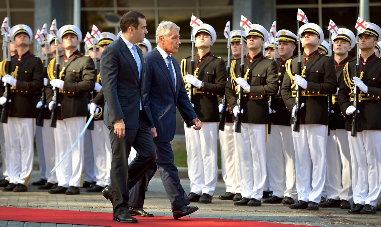 Secretary of Defense Chuck Hagel is escorted past an honor cordon by Georgian Minister of Defense Irakli Alasania during a ceremony welcoming Hagel to the defense ministry in Tbilisi, Georgia, Sept. 7, 2014. DoD Photo by Glenn Fawcett