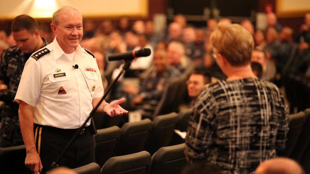 Chairman of the Joint Chiefs of Staff Gen. Martin Dempsey answers a question during a town hall meeting with Marines, sailors and former service members aboard Naval Station Great Lakes, Ill., Sept. 5. Dempsey discussed a wide range of topics including involvement in the Middle East, and how budget cuts affect service members worldwide.