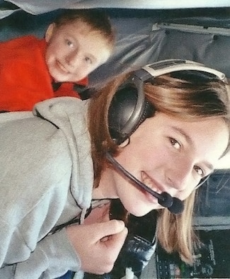 Danielle Repp, right, pictured above at age 15, flies on a KC-135 Stratotanker in 2005. Today, as a senior airman, Repp is a boom operator with the 351st Air Refueling Squadron from Spokane, Wash.This was Repp’s first experience with aerial refueling and sparked her interest in the career field. (Photo courtesy of Daniel Repp)